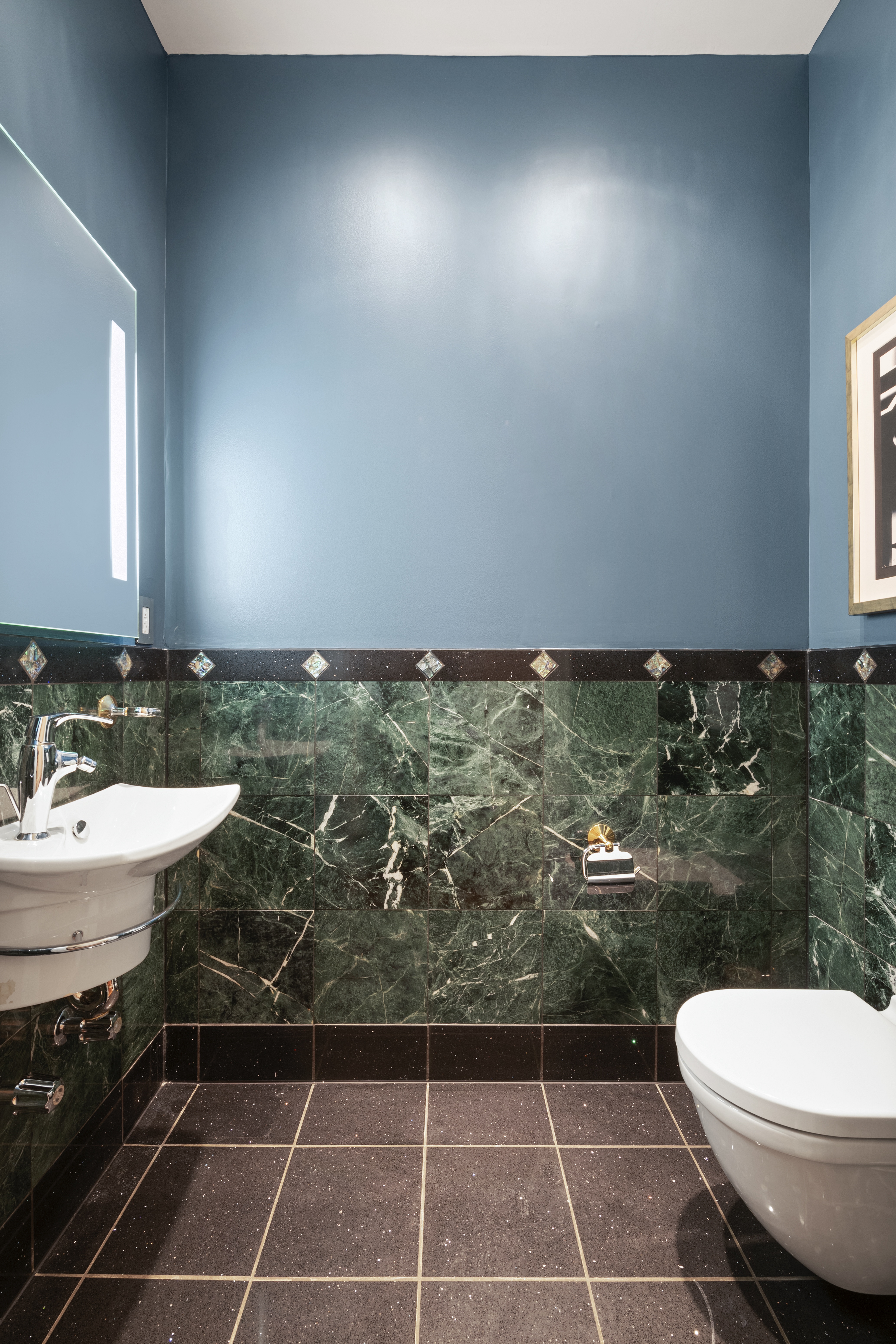 205 West 57th Street, Unit 3DB Manhattan, NY 10019 - Photo 13 of 25 a bathroom with a toilet a sink and mirror