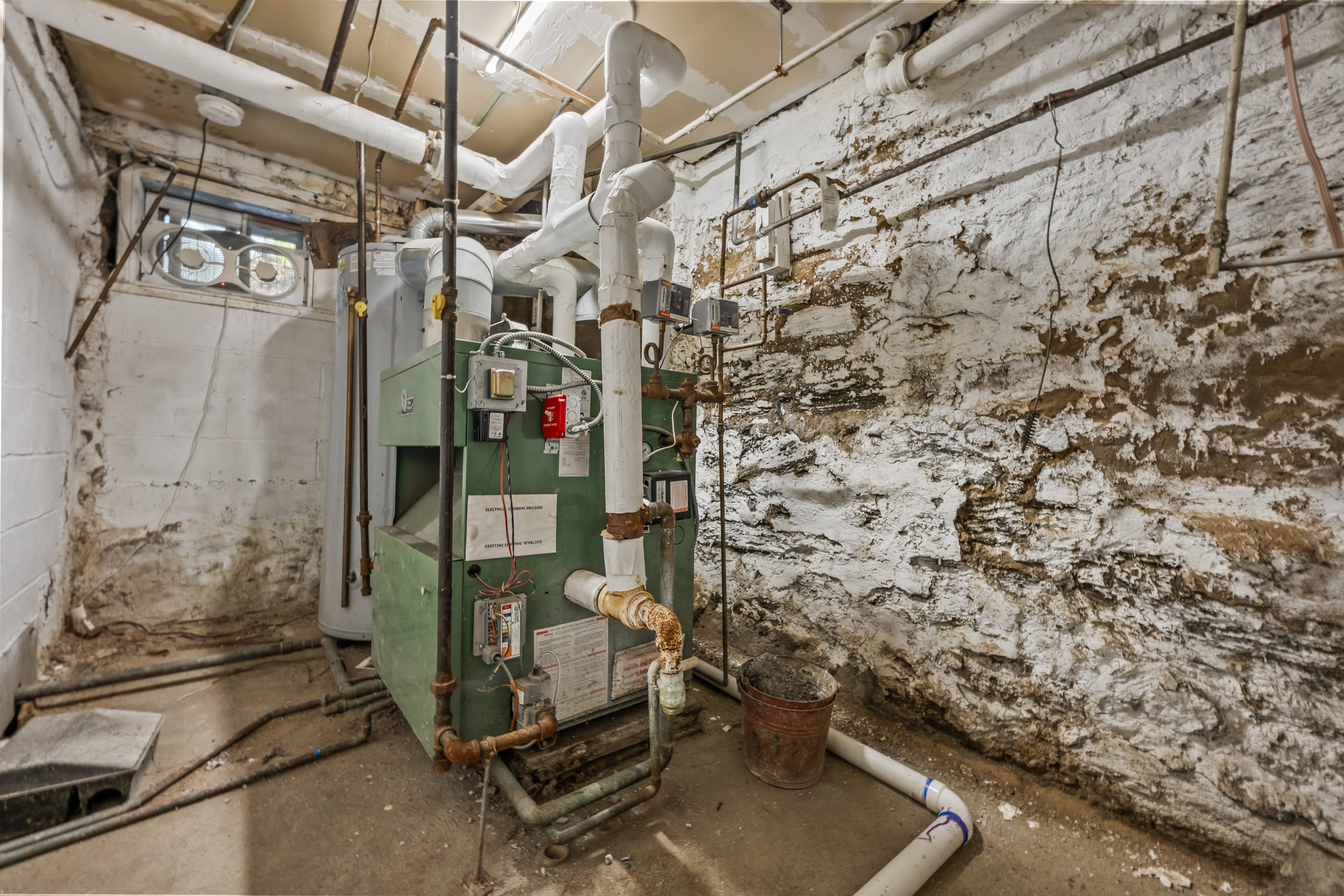 2023 Hughes Avenue Bronx, NY 10457 - Photo 20 of 63 a room with water heater on the wall