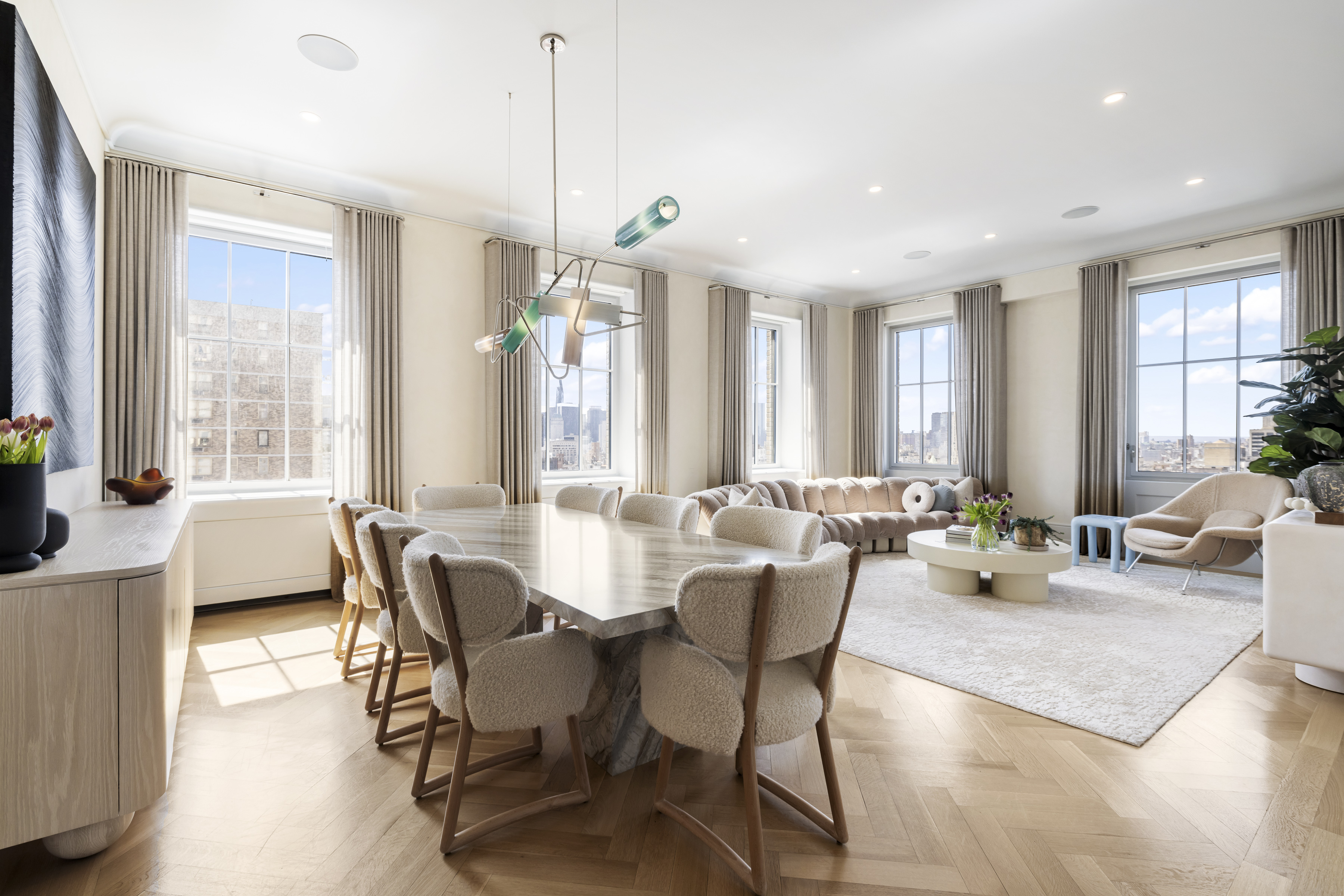 a view of a dining room with furniture window and wooden floor