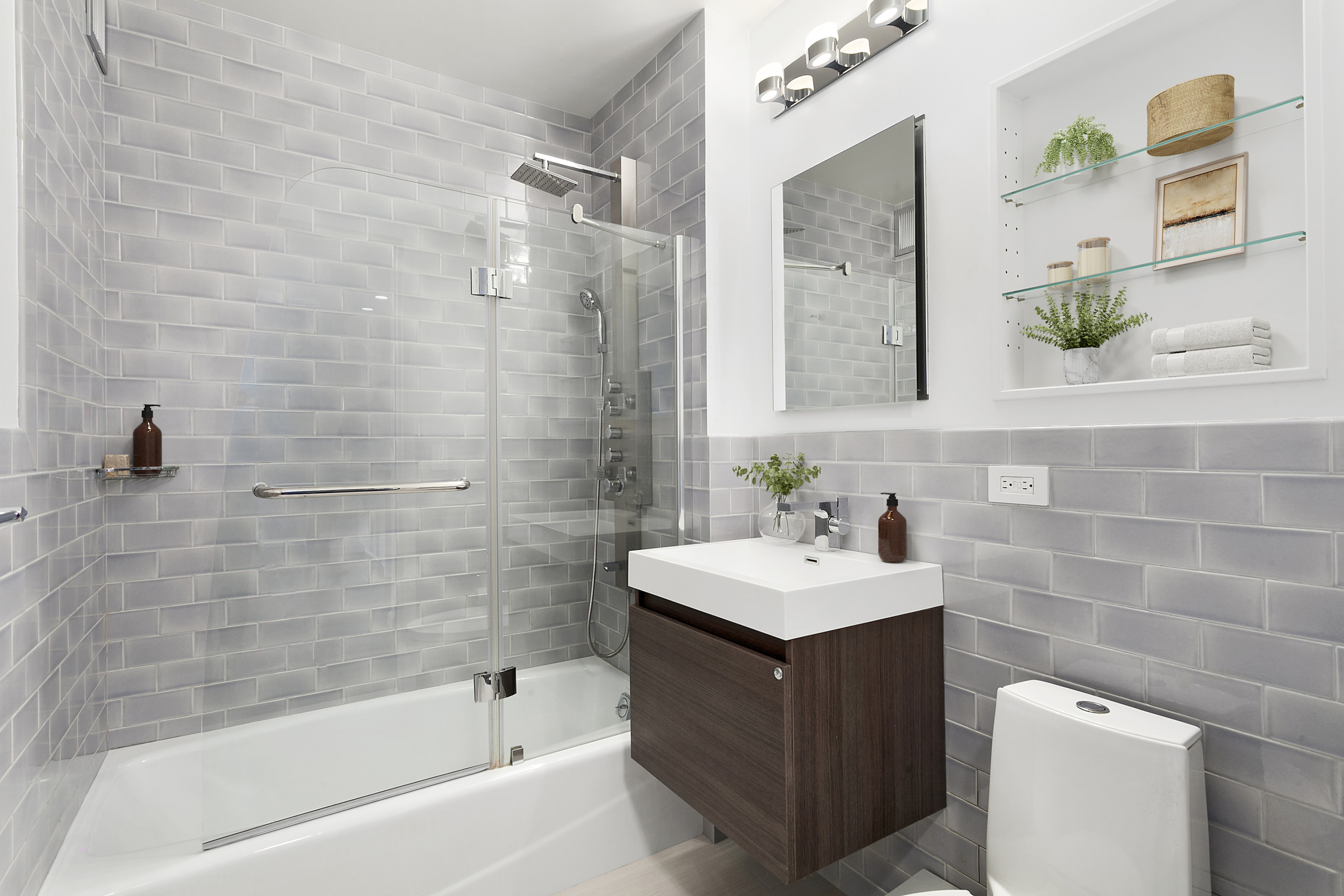 22 West 15th Street, Unit 7E Manhattan, NY 10011 - Photo 6 of 10 a bathroom with a sink mirror toilet and bathtub