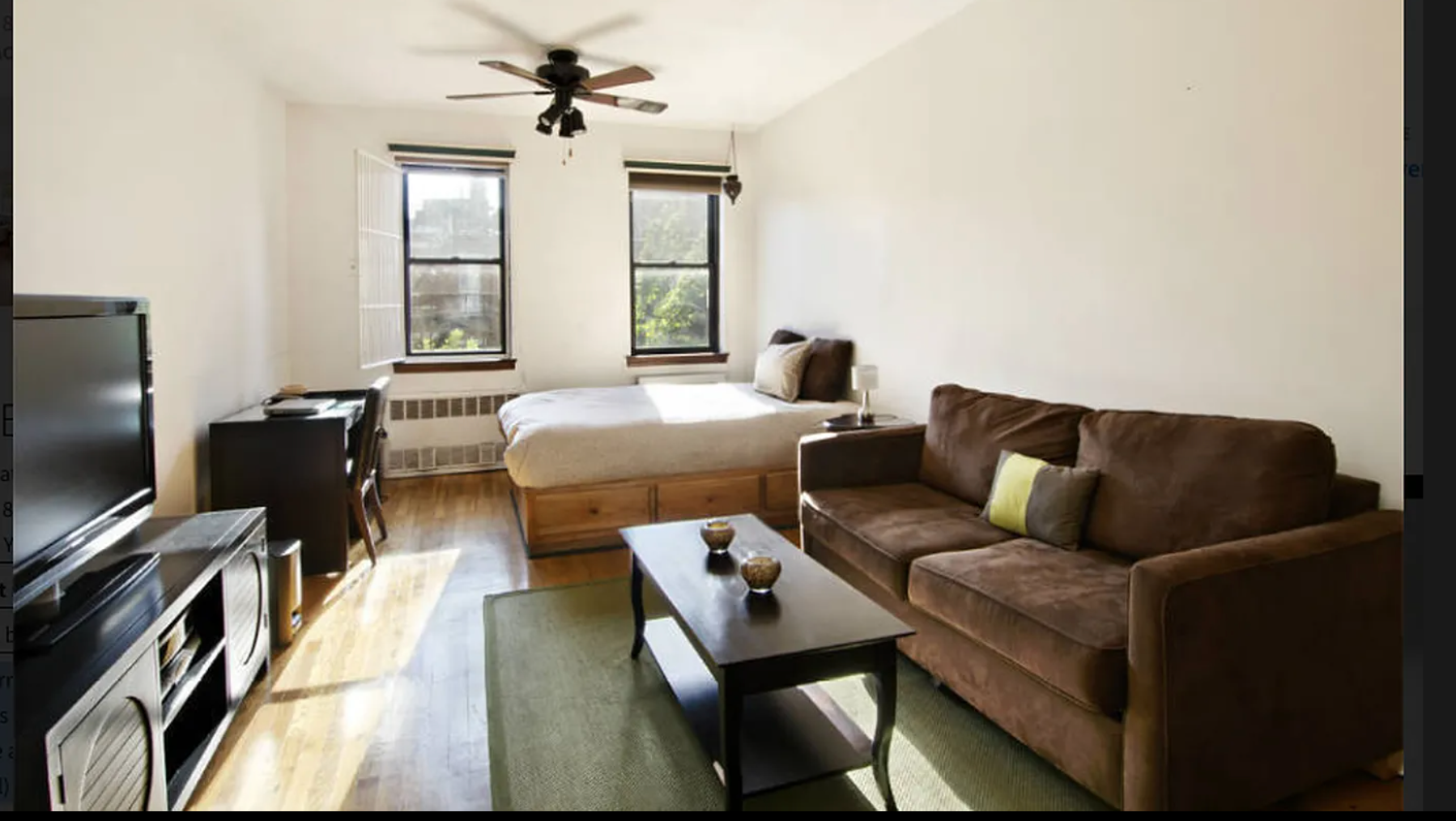 a living room with fireplace furniture and a flat screen tv