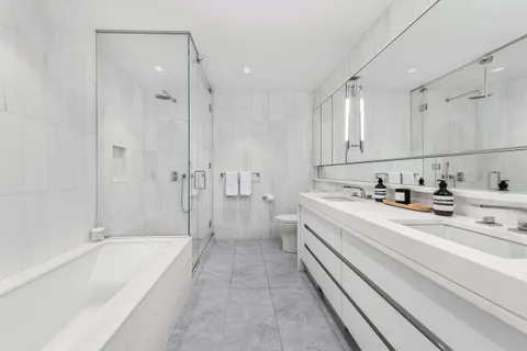 a bathroom with a bathtub and a sink