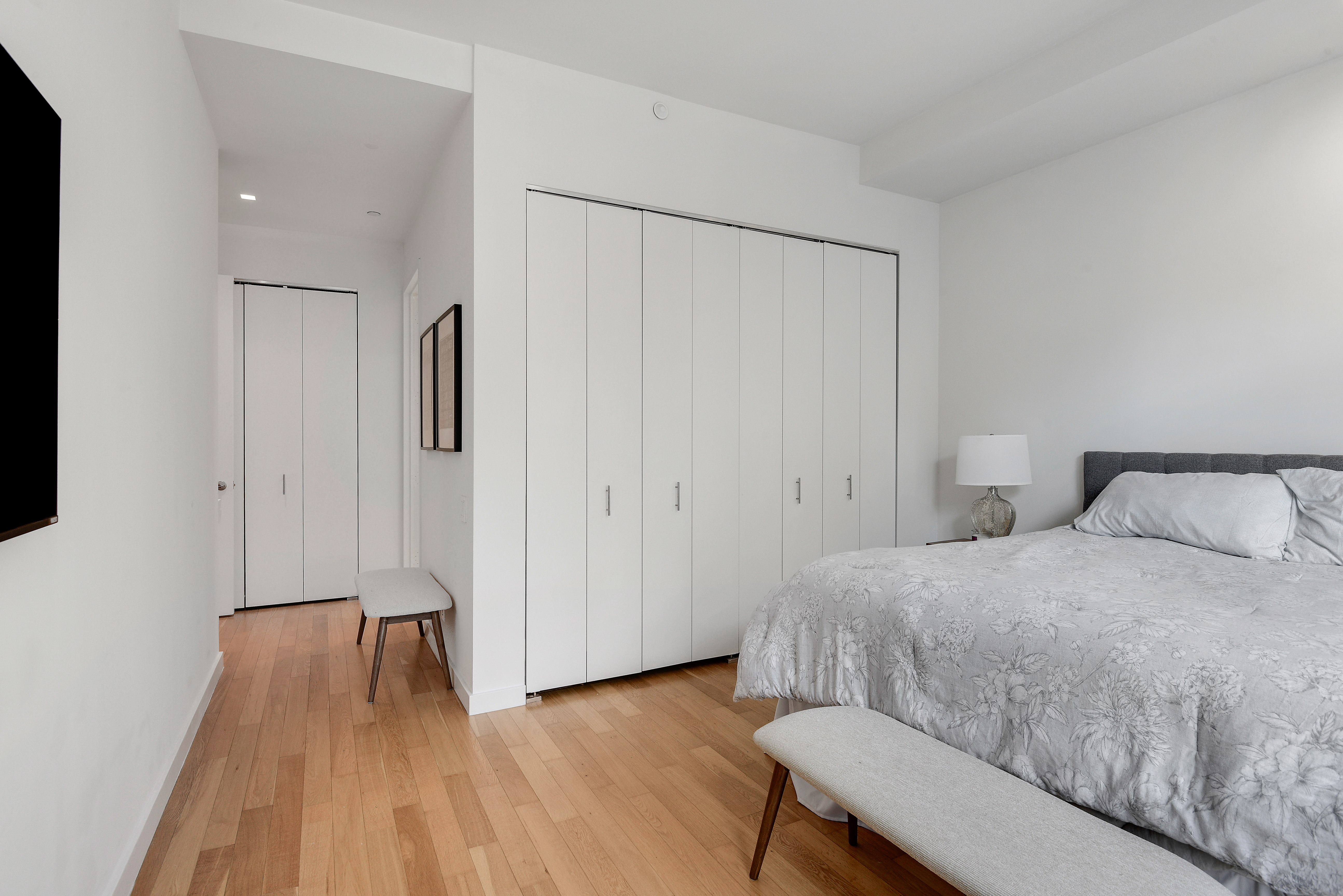 325 5th Avenue, Unit 16C Manhattan, NY 10016 - Photo 7 of 25 a bedroom with a bed and a table