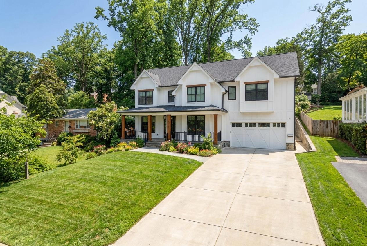 6027 Walhonding Road Bethesda, MD 20816 - Photo 2 of 9 a front view of a house with a yard