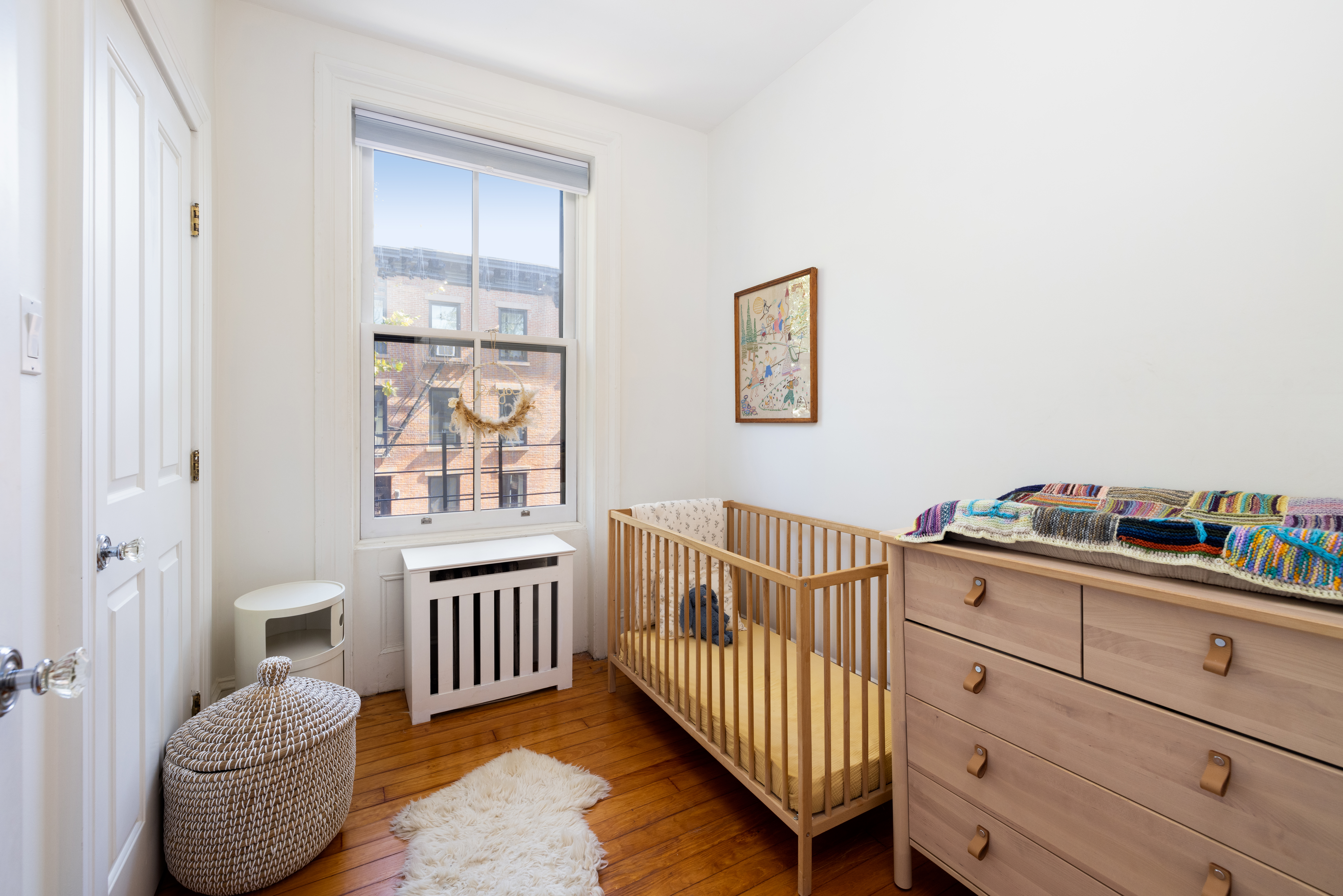 188 Warren Street, Unit TRIPLEX Brooklyn, NY 11201 - Photo 9 of 15 a bedroom with furniture and a window