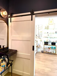 a dining table chair next to a window
