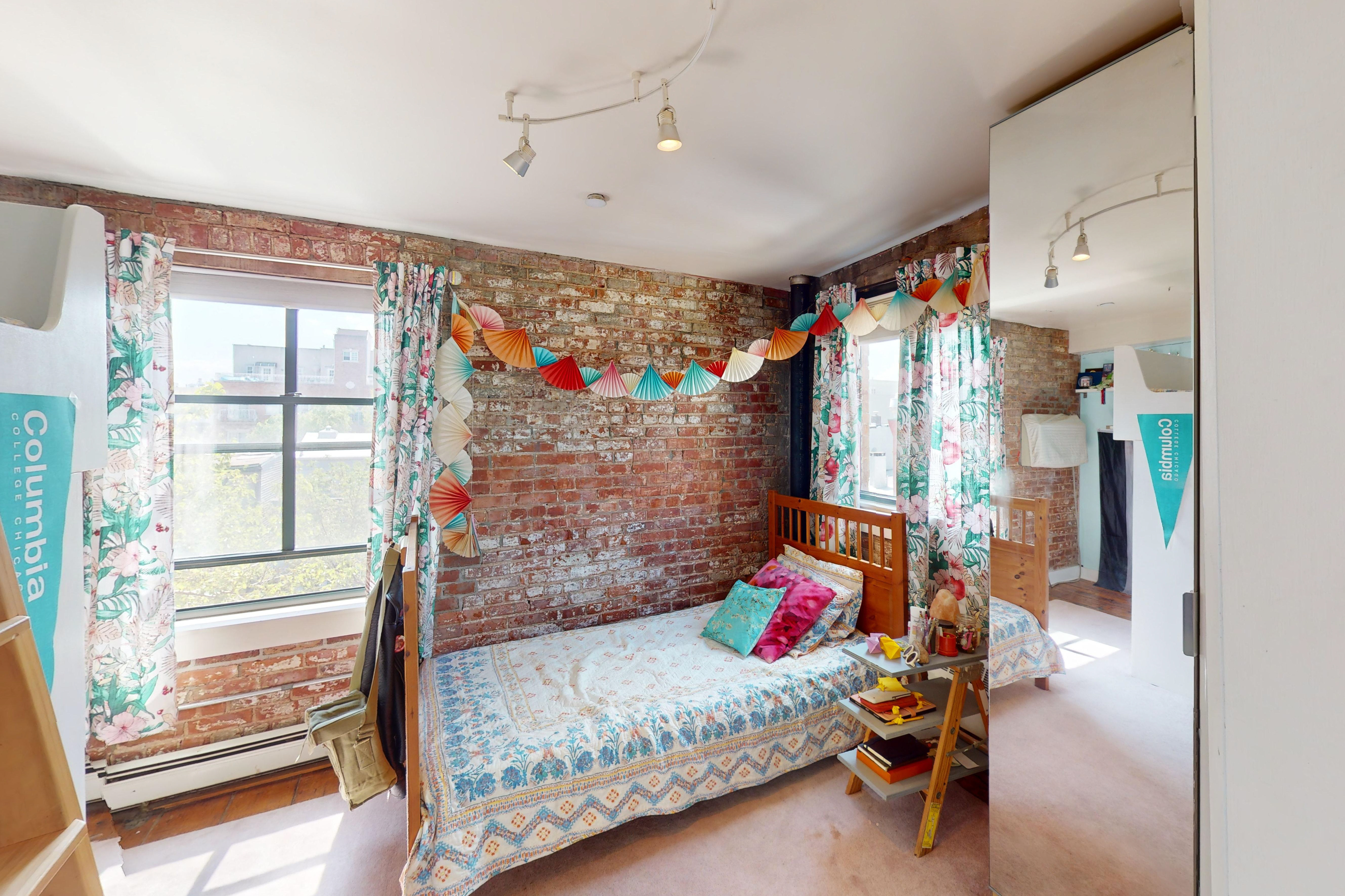 248 17th Street, Unit 6 Brooklyn, NY 11215 - Photo 12 of 21 a bedroom with a bed and a window