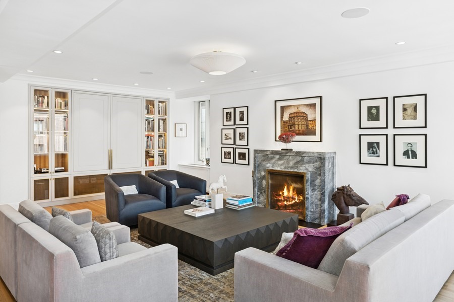 350 East 57th Street, Unit 14B Manhattan, NY 10022 - Photo 4 of 14 a living room with furniture and a fireplace