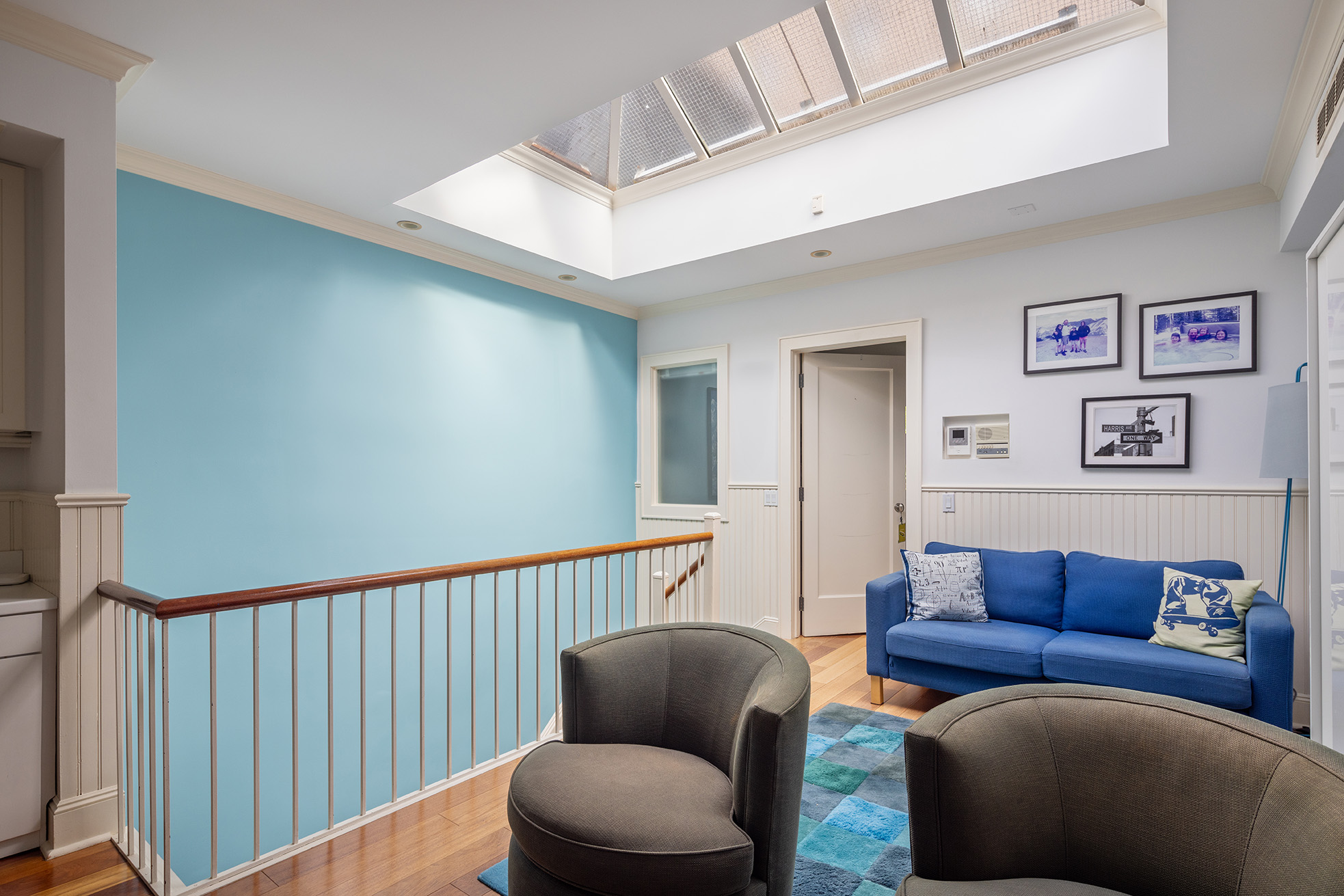 217 West 22nd Street Manhattan, NY 10011 - Photo 11 of 16 a living room with furniture and a wooden floor