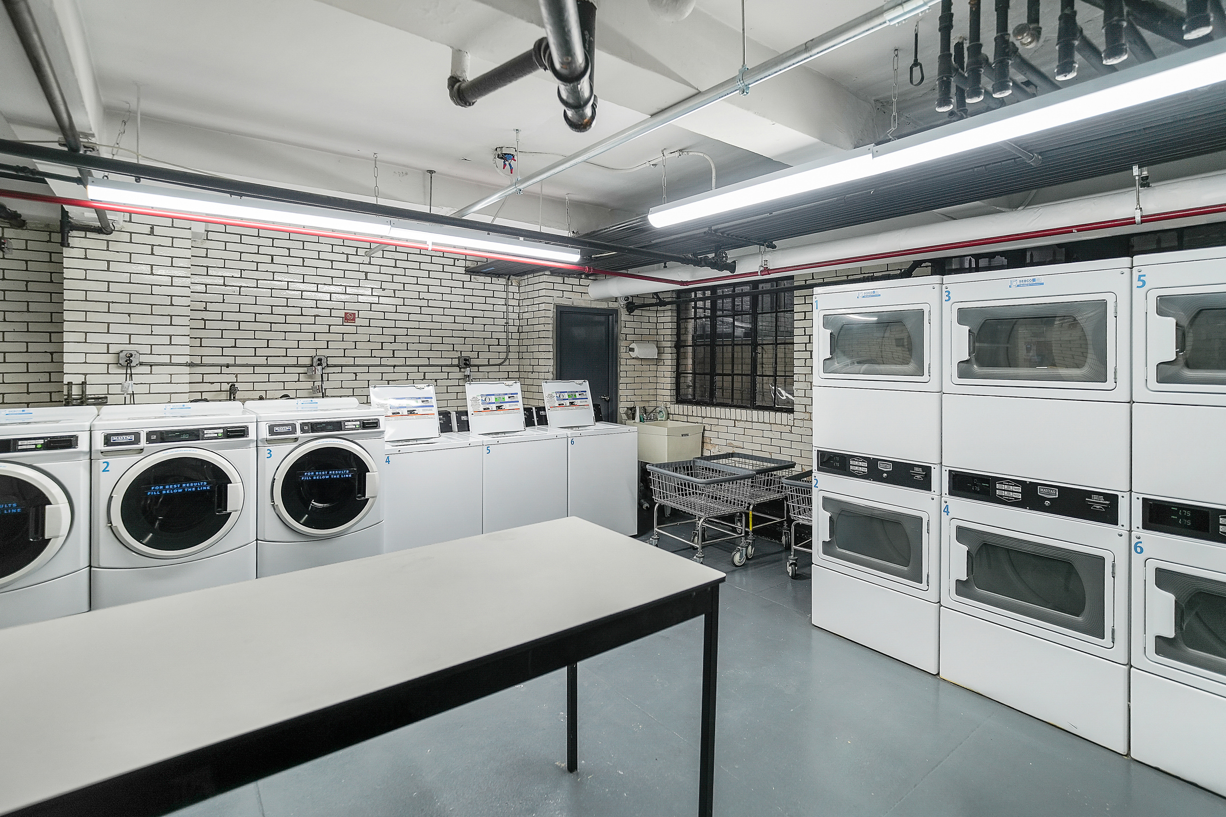 102 West 85th Street, Unit 2B Manhattan, NY 10024 - Photo 15 of 16 a utility room with dryer and washer