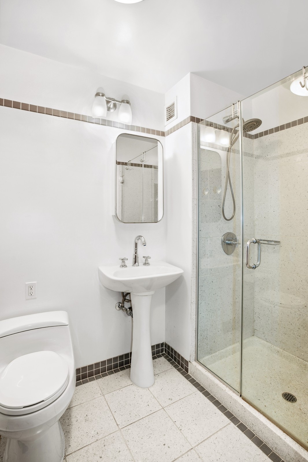 145 Park Place, Unit 4E Brooklyn, NY 11217 - Photo 9 of 15 a bathroom with a sink toilet and shower