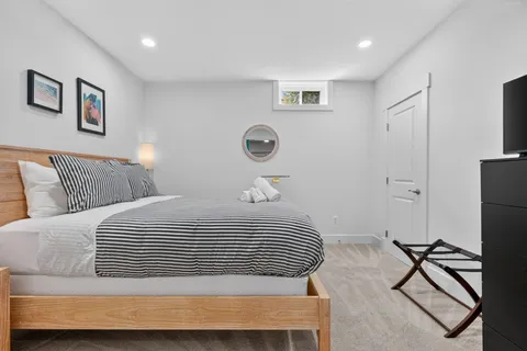 a bedroom with a bed and a lamp