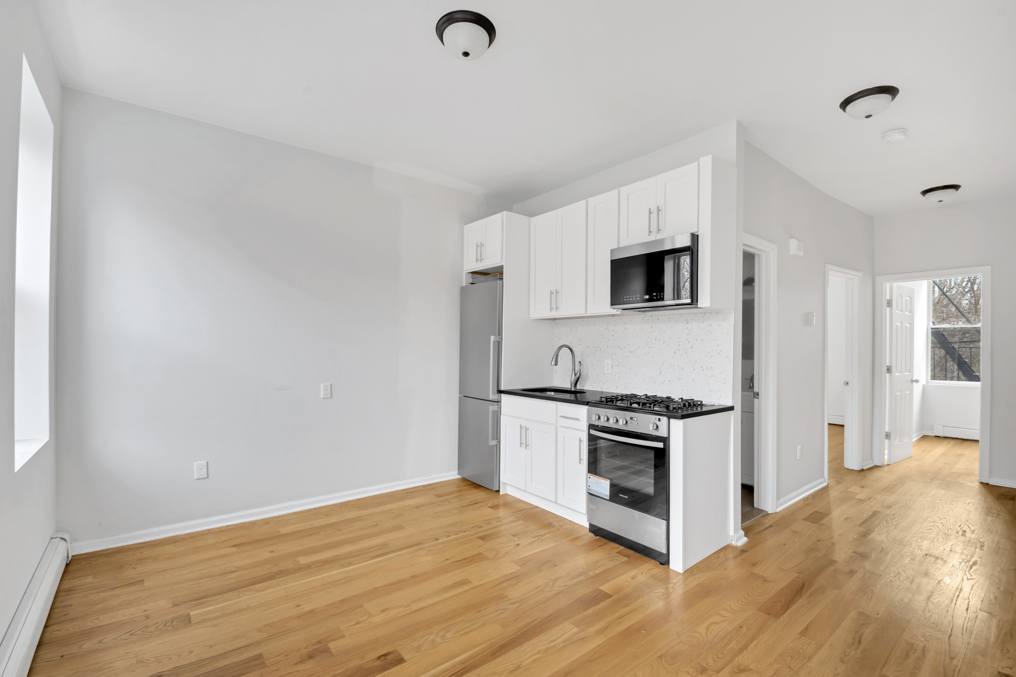 a kitchen with a stove and a microwave