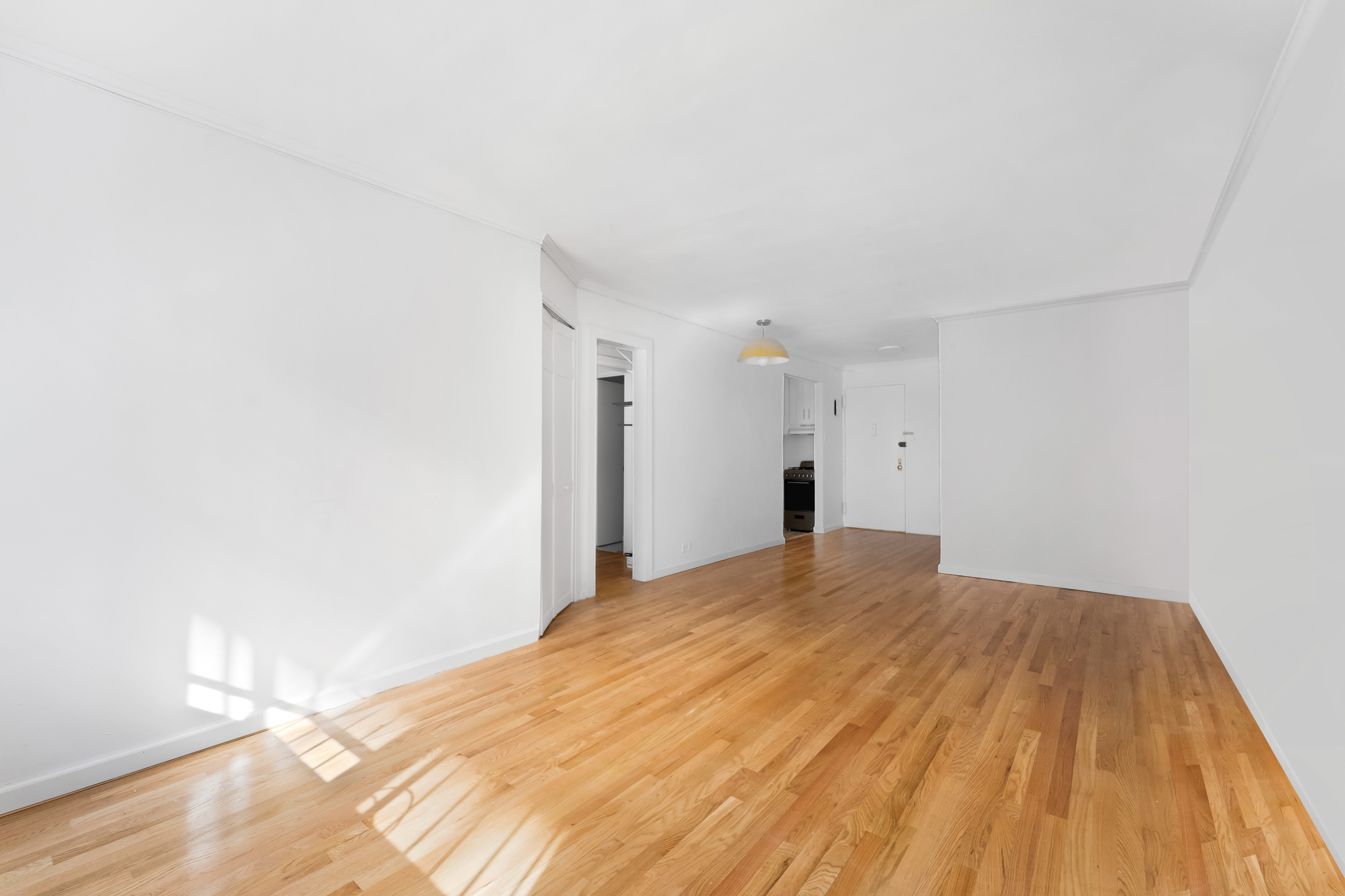 165 Christopher Street, Unit LV Manhattan, NY 10014 - Photo 4 of 16 a bedroom with a bed and a wooden floor
