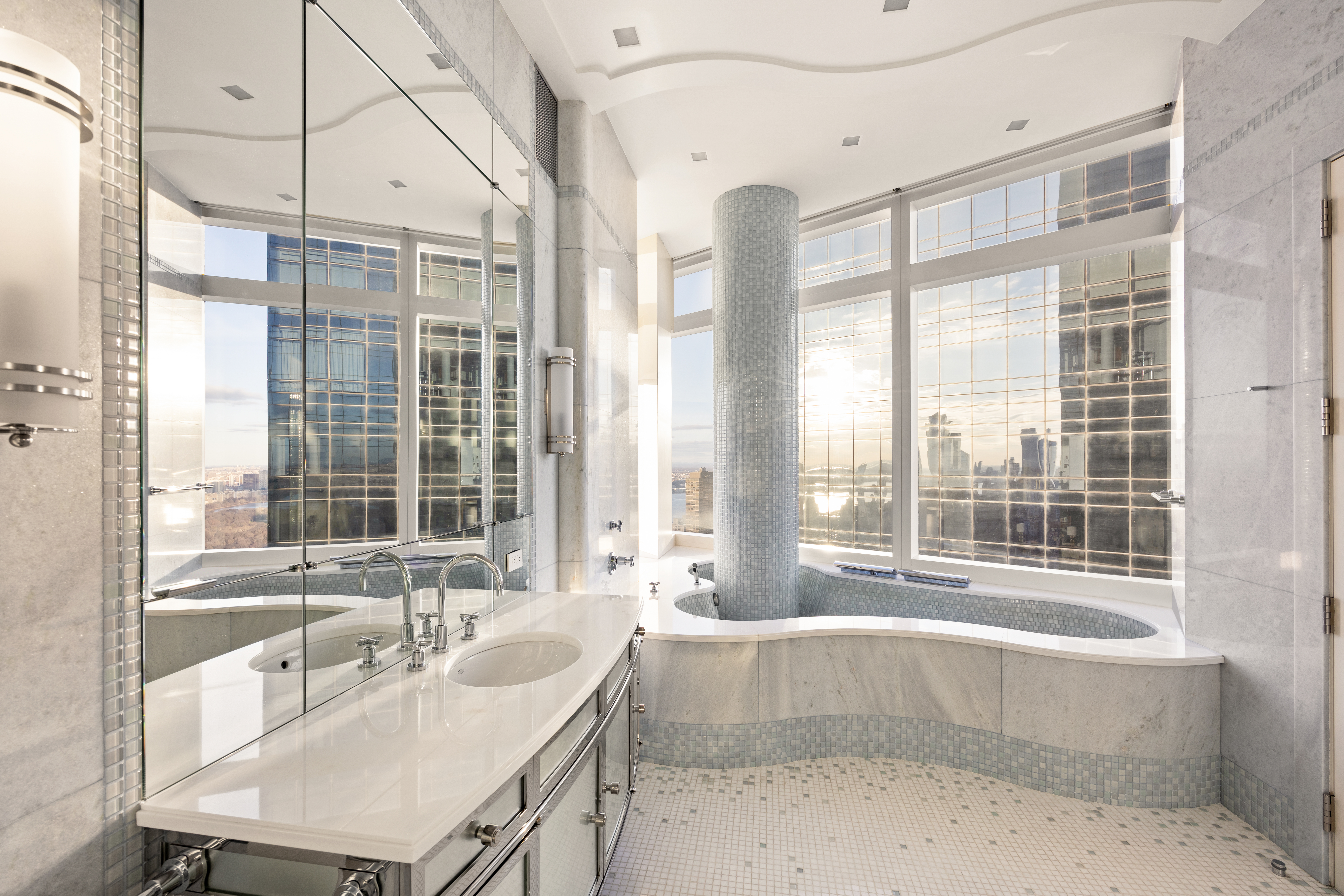 25 Columbus Circle, Unit 75A Manhattan, NY 10019 - Photo 15 of 36 a bathroom with a granite countertop tub and a sink