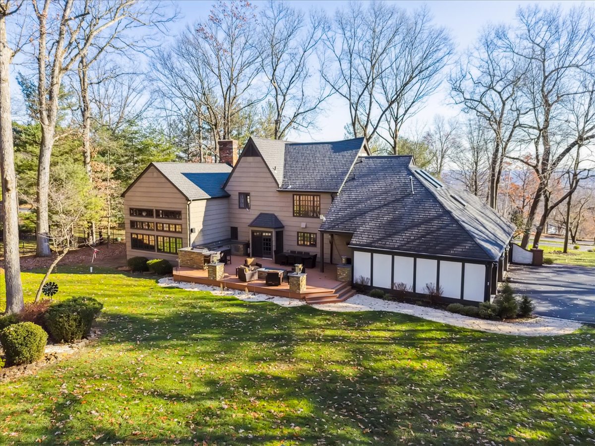 Johnston Drive Watchung, NJ 07069 - Photo 12 of 85 a view of a house with swimming pool and sitting area