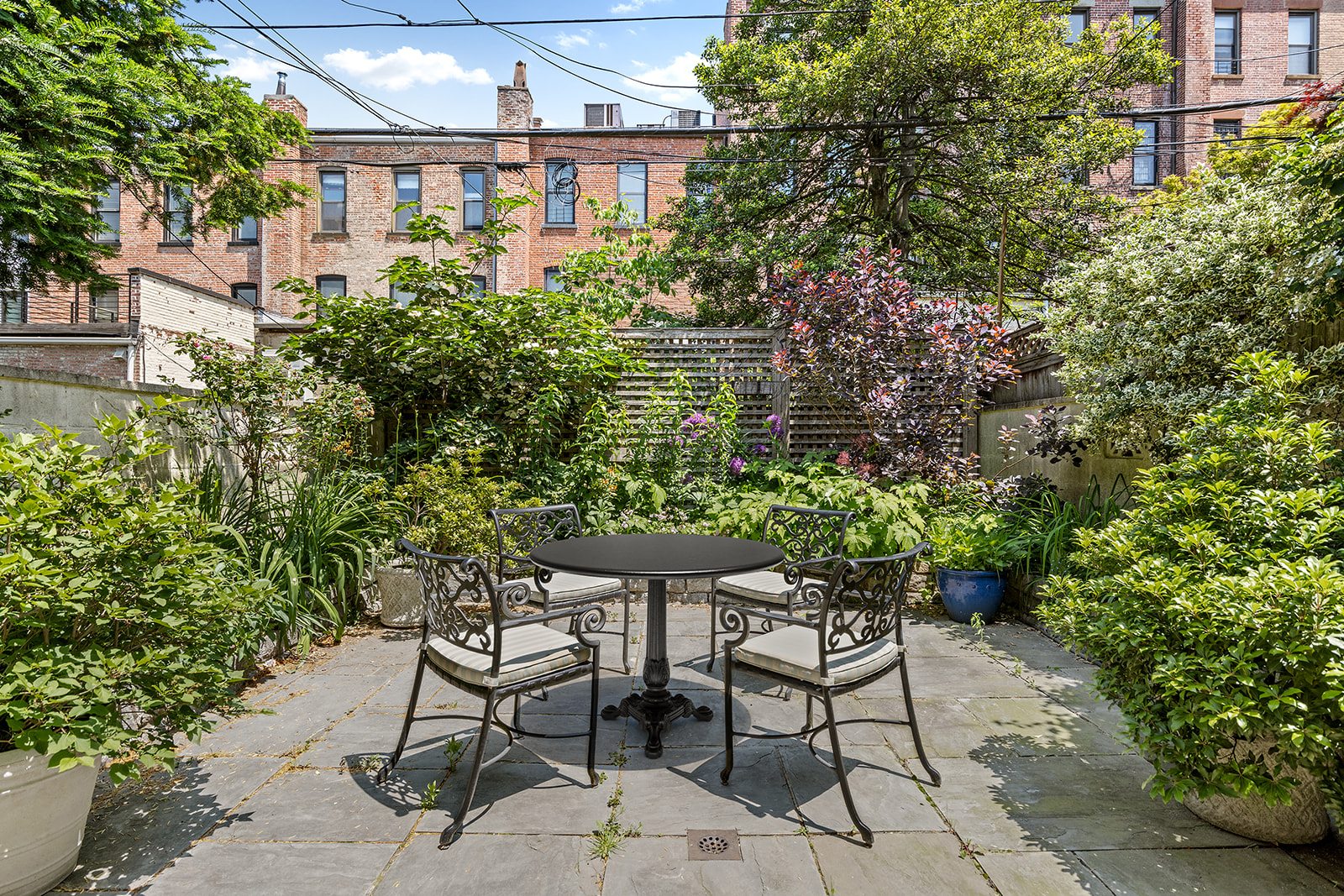623 2nd Street Brooklyn, NY 11215 - Photo 23 of 26 a view of a chairs and table in a backyard