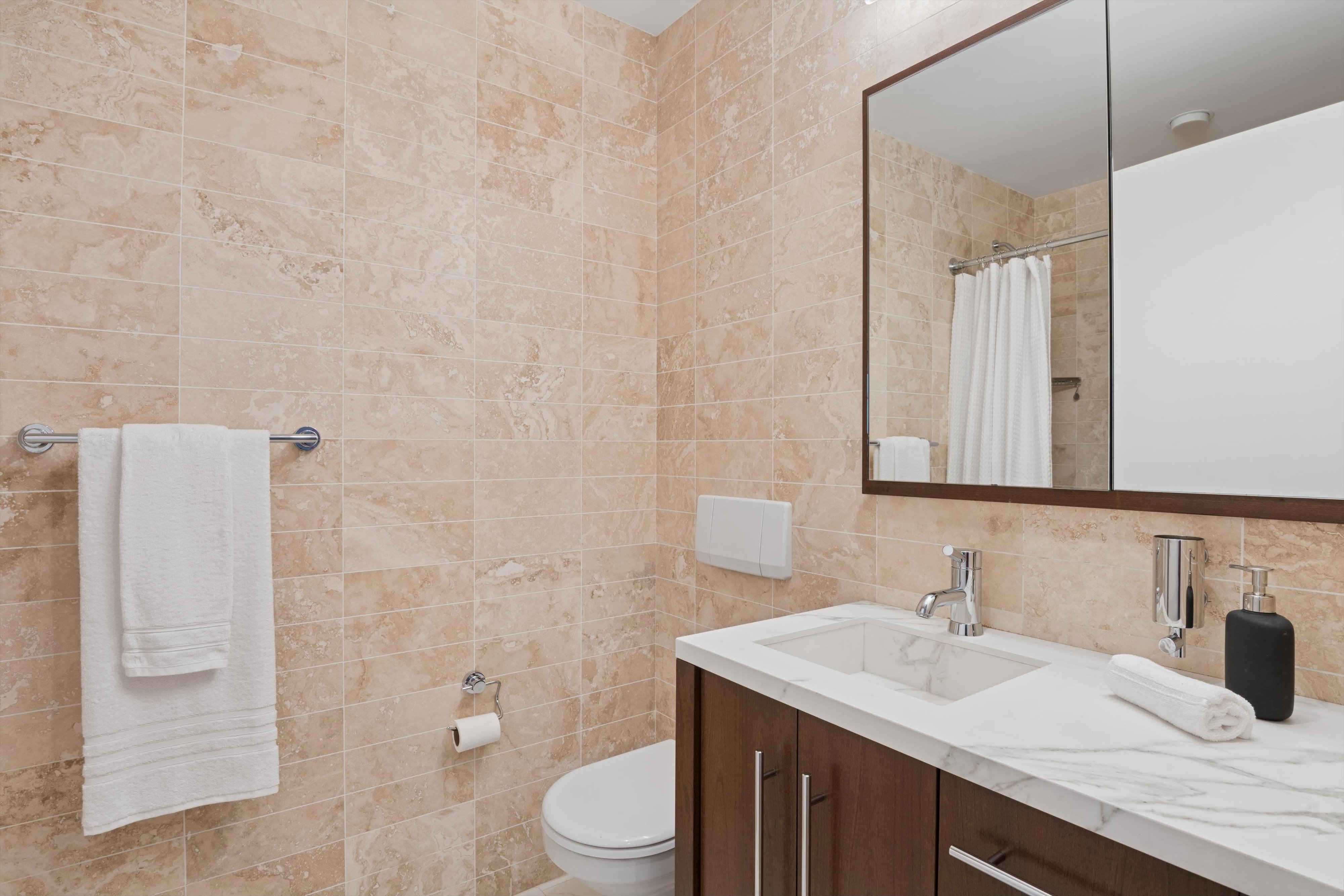 109 West 26th Street, Unit 9 Manhattan, NY 10001 - Photo 16 of 23 a bathroom with a sink toilet vanity and shower