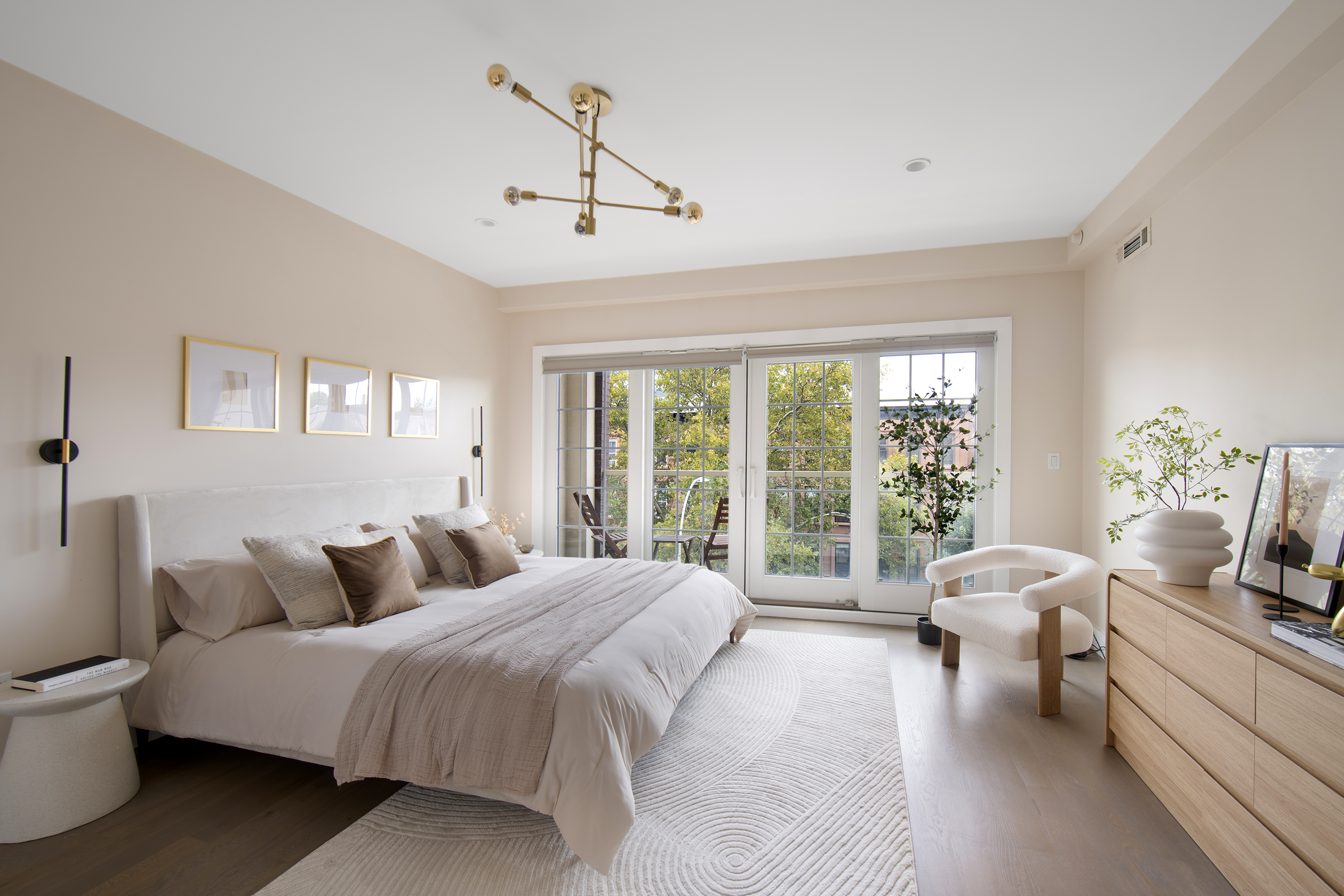 476 Hancock Street, Unit 3 Brooklyn, NY 11233 - Photo 5 of 9 a bedroom with a large bed and windows