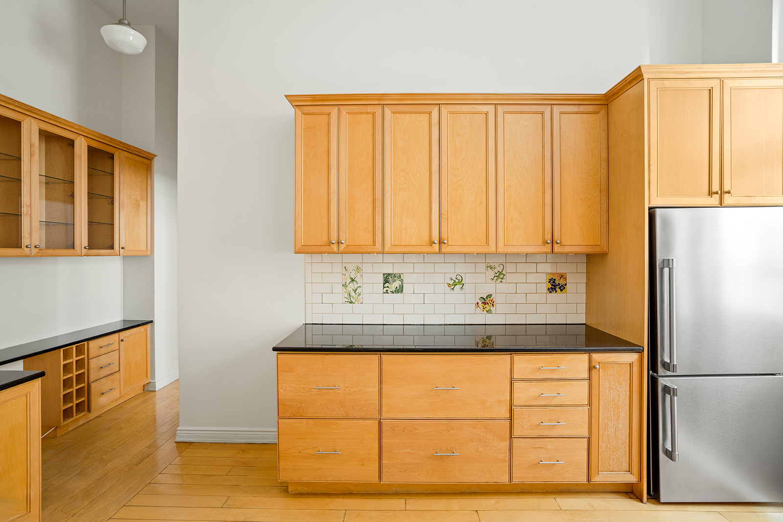 885 West End Avenue, Unit GC Manhattan, NY 10025 - Photo 5 of 13 a kitchen with a refrigerator and cabinets