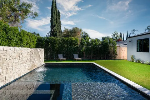a kitchen with a table and chairs in it
