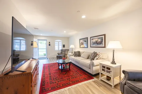 a living room with furniture and a table