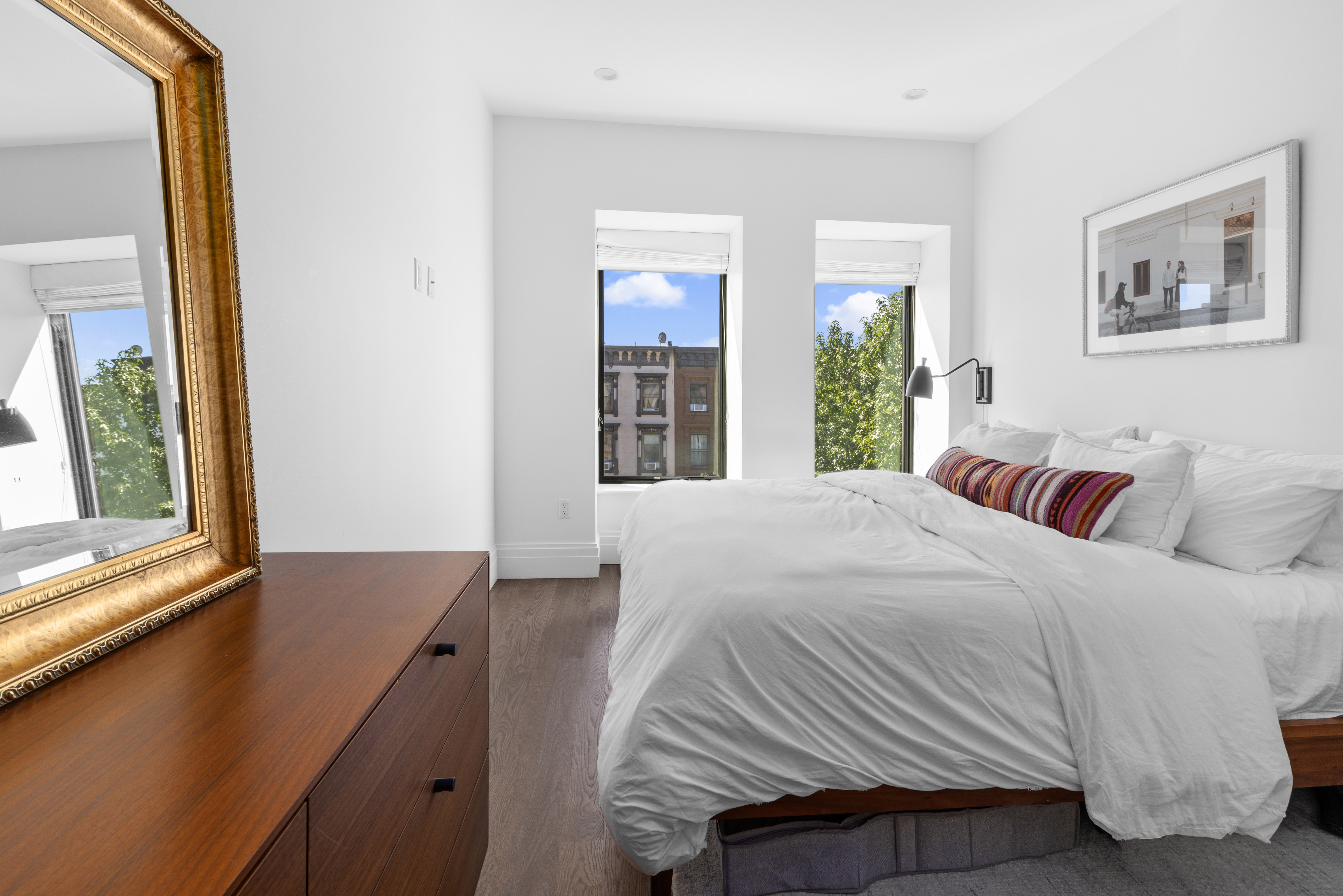 773 Greene Avenue, Unit 4 Brooklyn, NY 11221 - Photo 5 of 10 a bedroom with a bed and a large window