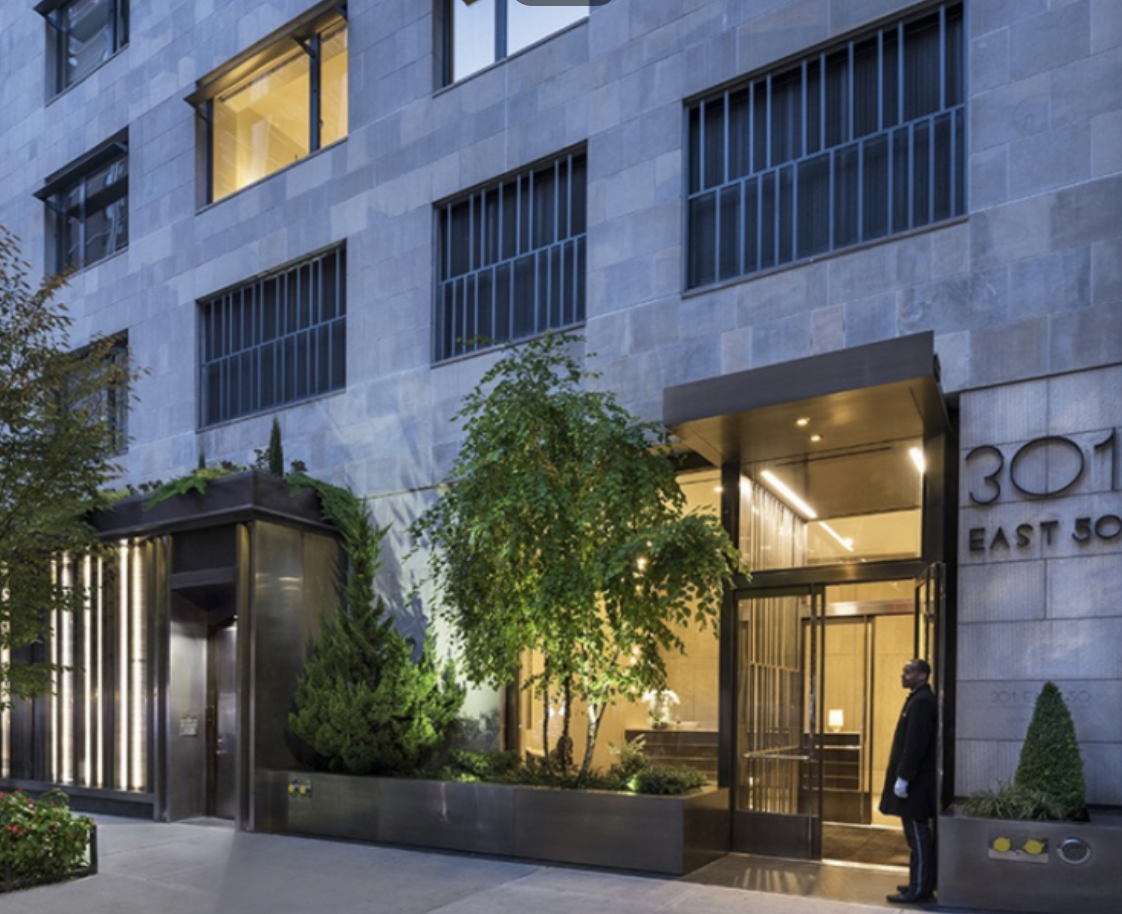 301 East 50th Street, Unit 17B Manhattan, NY 10022 - Photo 11 of 12 a view of a brick house with a large windows