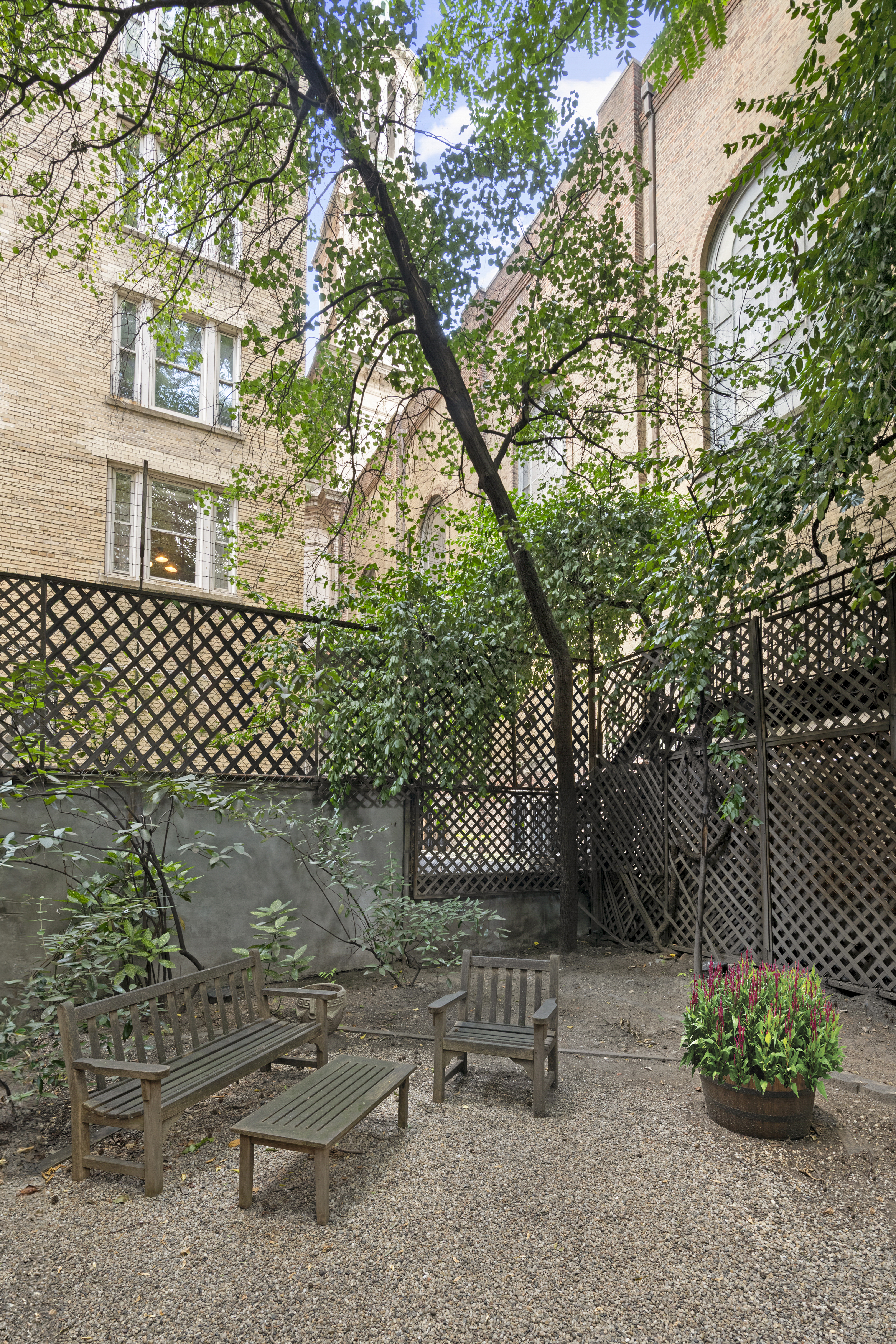 157 East 75th Street, Unit 1E Manhattan, NY 10021 - Photo 8 of 11 a view of a chairs and table in backyard