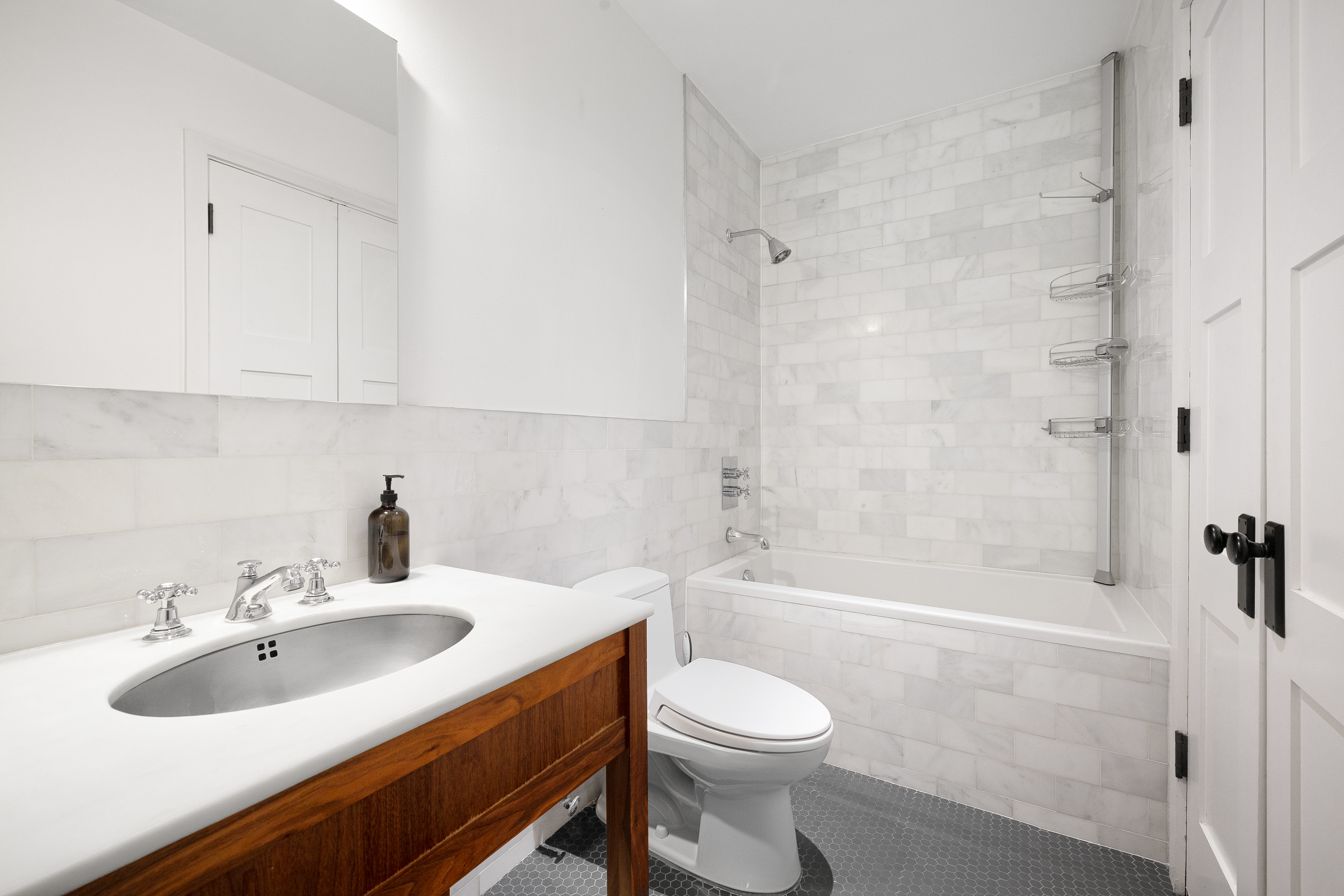 174 Jackson Street, Unit 2A Brooklyn, NY 11211 - Photo 10 of 17 a bathroom with a sink toilet a shower and bathtub