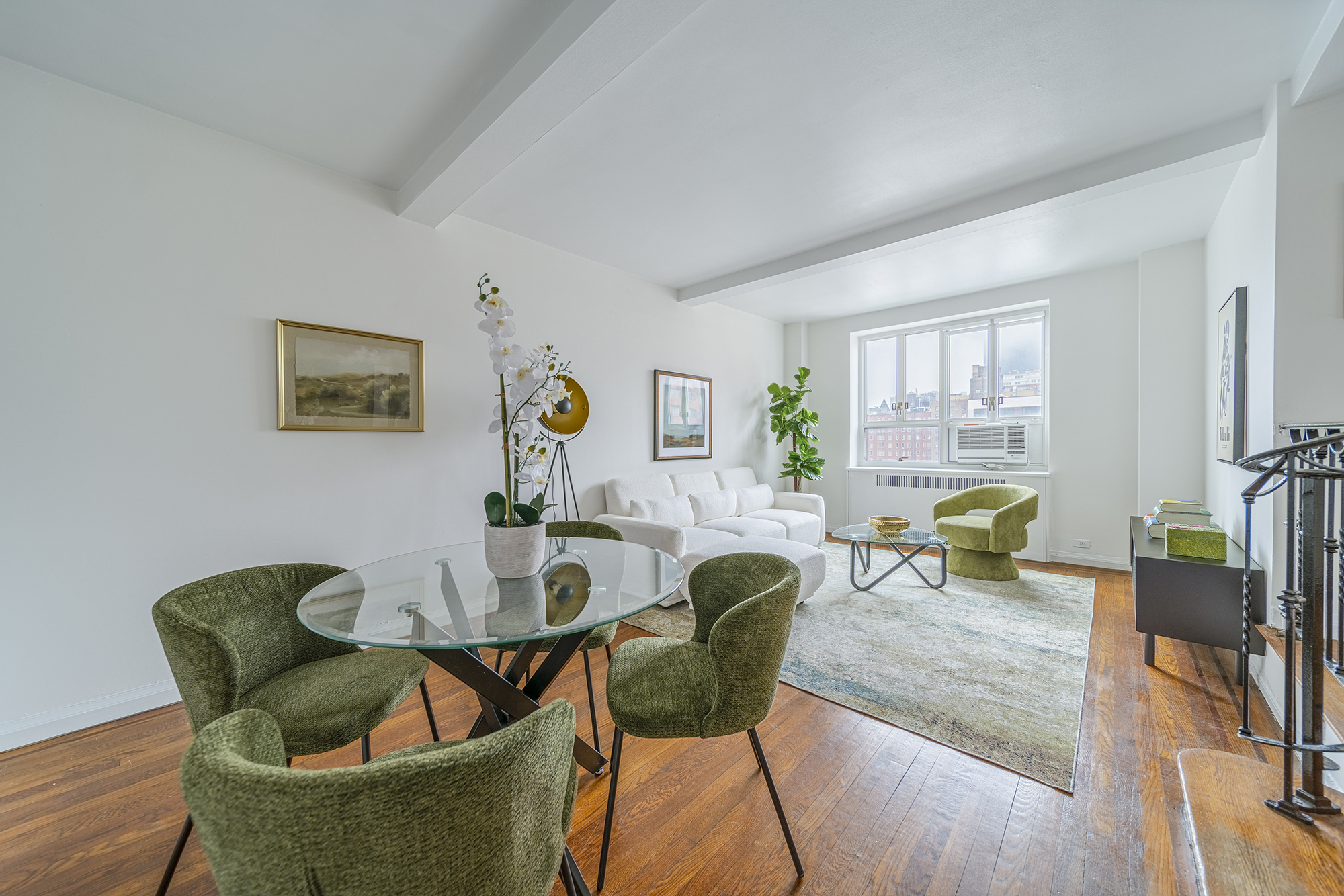 200 West 20th Street, Unit 1208 Manhattan, NY 10011 - Photo 5 of 14 a dining room with furniture and wooden floor