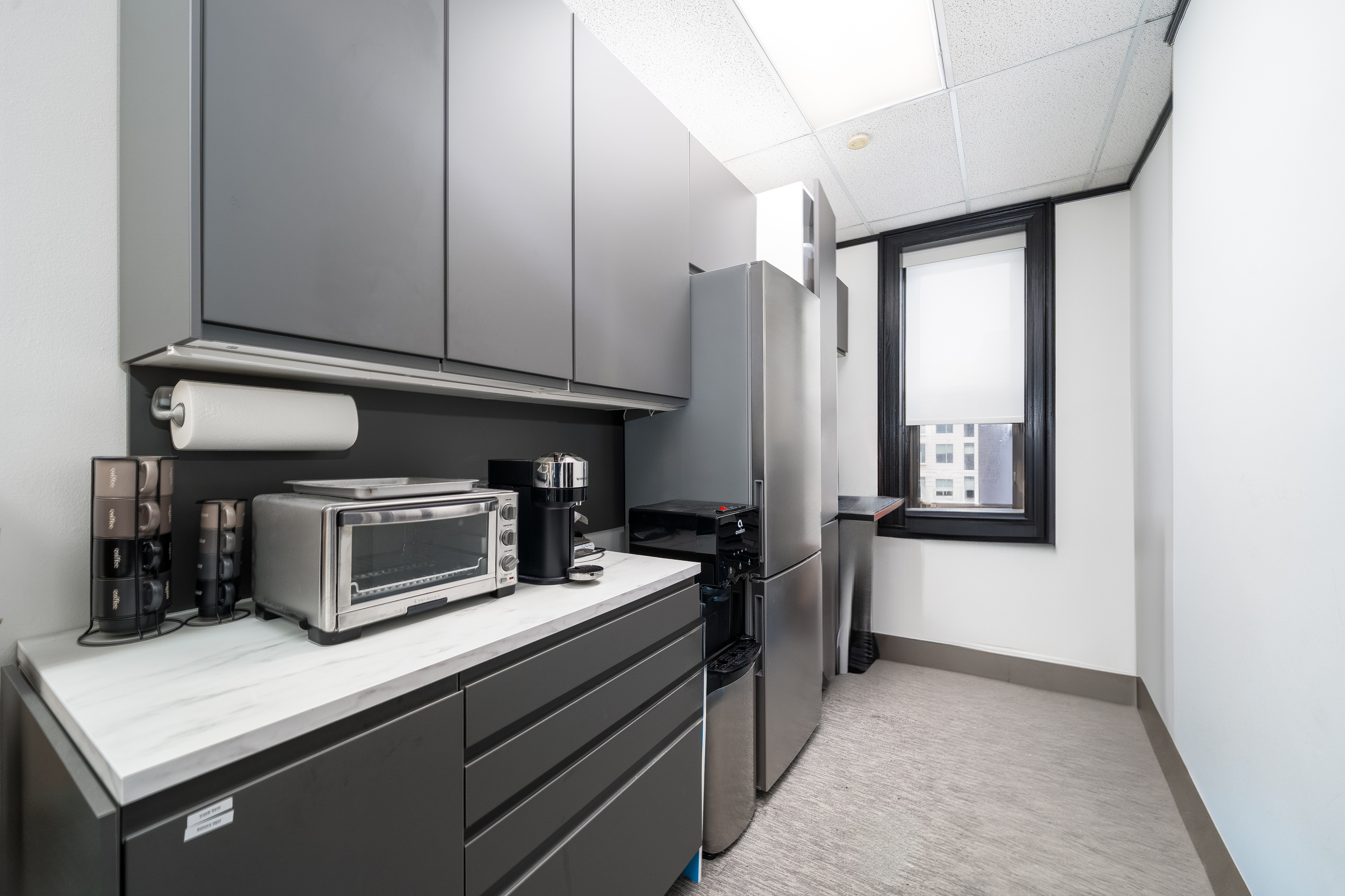 84 Washington Street Hoboken, NJ 07030 - Photo 4 of 11 a kitchen with stainless steel appliances a refrigerator and stove