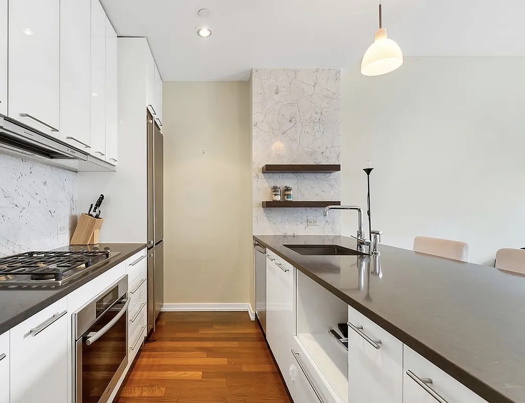 80 Metropolitan Avenue, Unit 2L Brooklyn, NY 11249 - Photo 2 of 5 a kitchen with a sink and a stove top oven