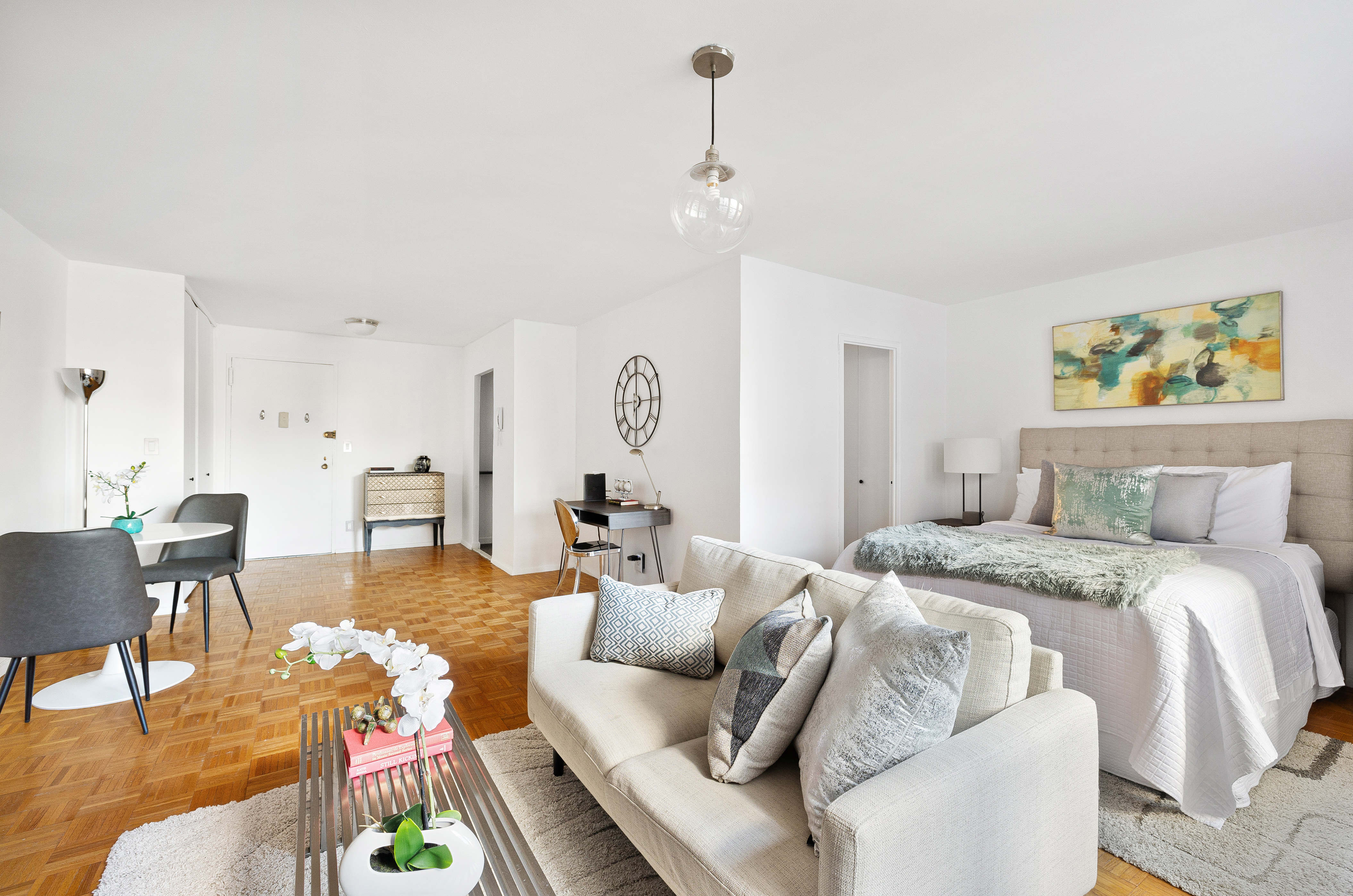 145 East 15th Street, Unit 7C Manhattan, NY 10003 - Photo 3 of 10 a living room with furniture and wooden floor
