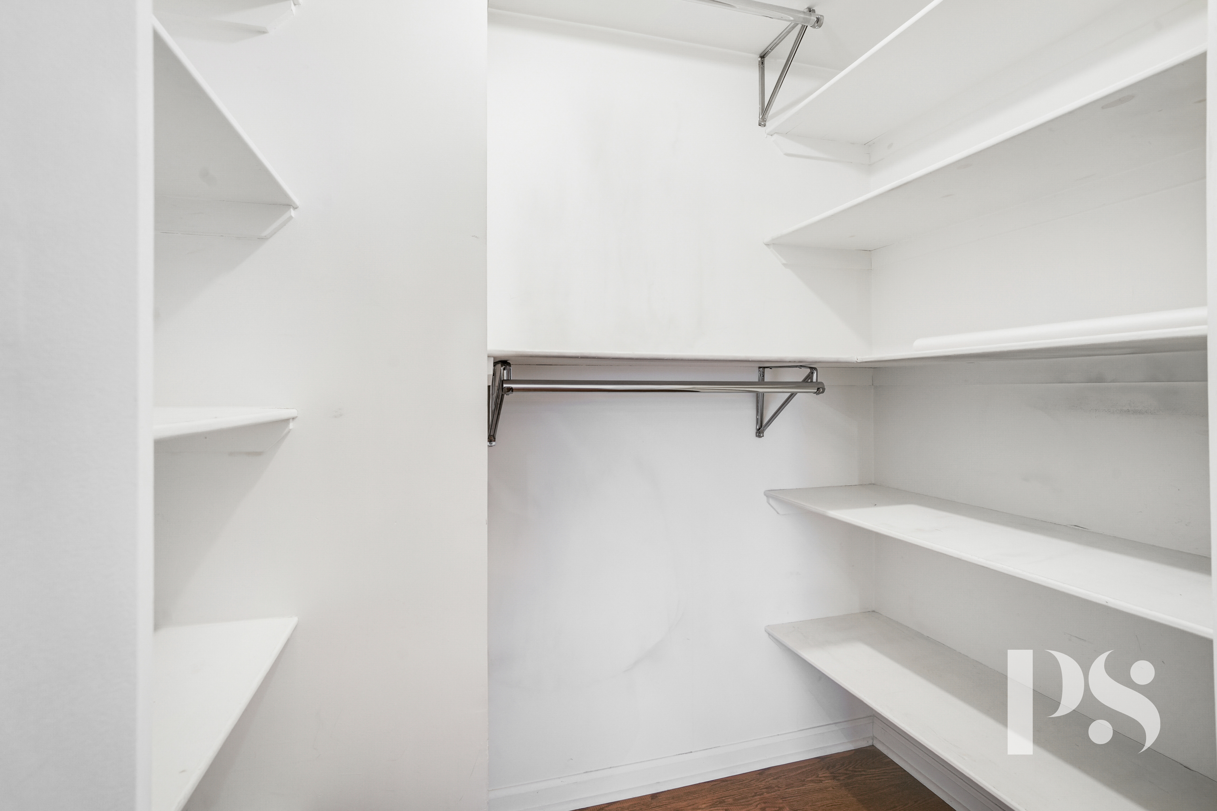 133 Barrow Street, Unit 1B Manhattan, NY 10014 - Photo 9 of 11 a view of walk in closet with empty racks