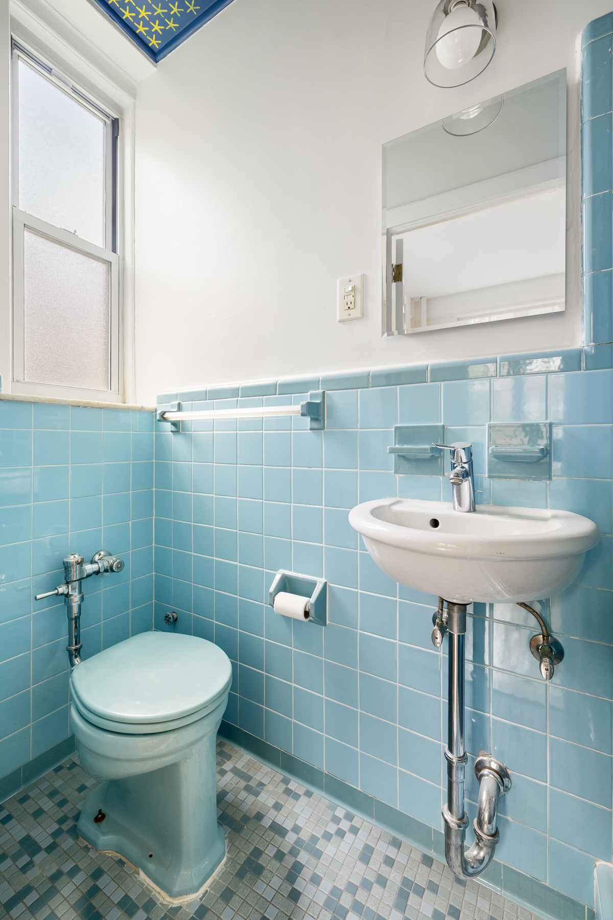 35-27 76th Street, Unit 21 Queens, NY 11372 - Photo 18 of 24 a bathroom with a sink a toilet and a mirror