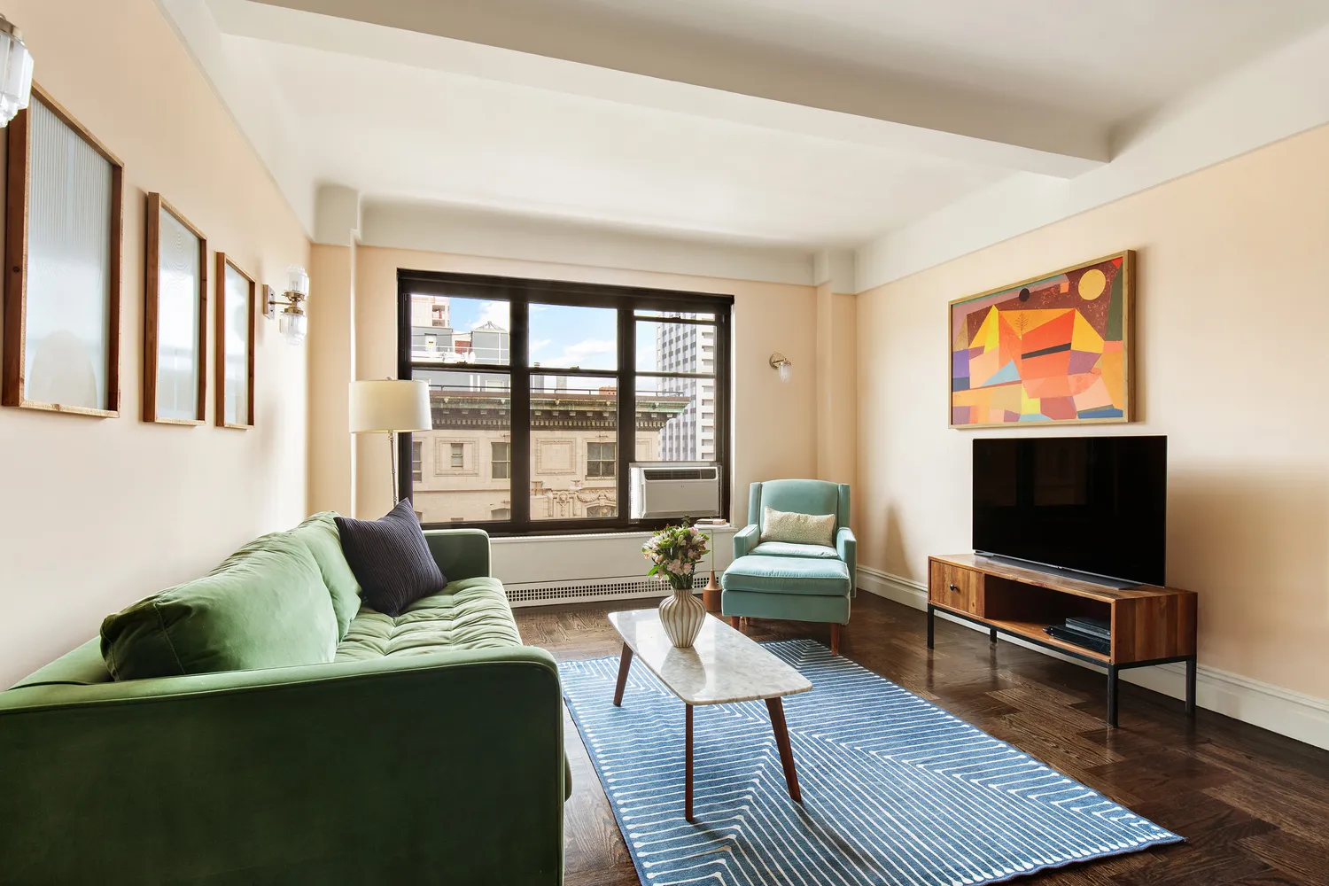 a living room with furniture and a flat screen tv