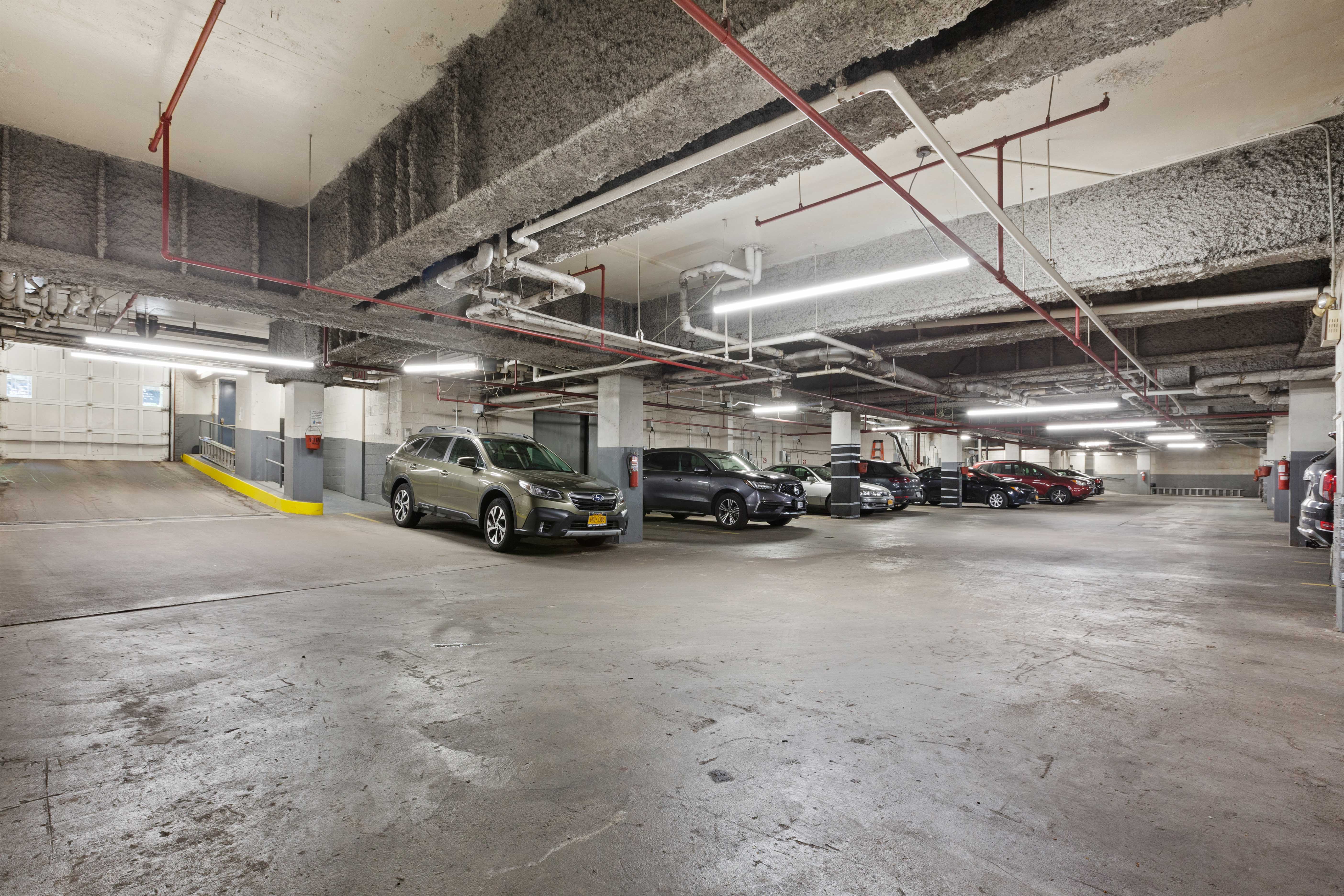207 East 74th Street, Unit 11E Manhattan, NY 10021 - Photo 15 of 20 a view of parking garage with cars