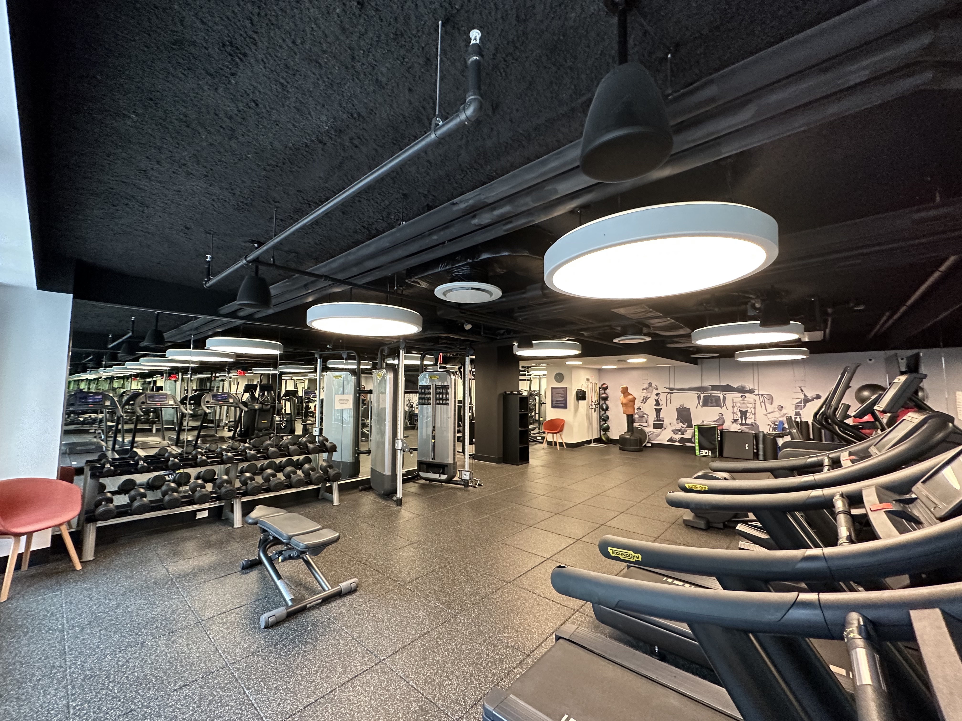 591 3rd Avenue, Unit 9C Manhattan, NY 10016 - Photo 11 of 13 a room with gym equipment and a table