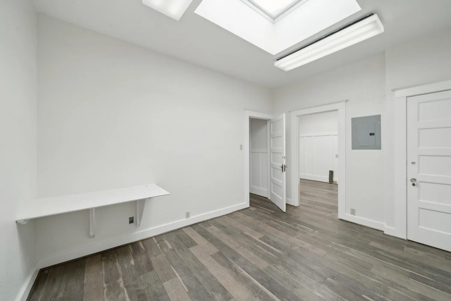 an empty room with wooden door