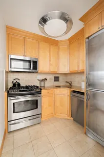 a kitchen with a stove a sink and a microwave