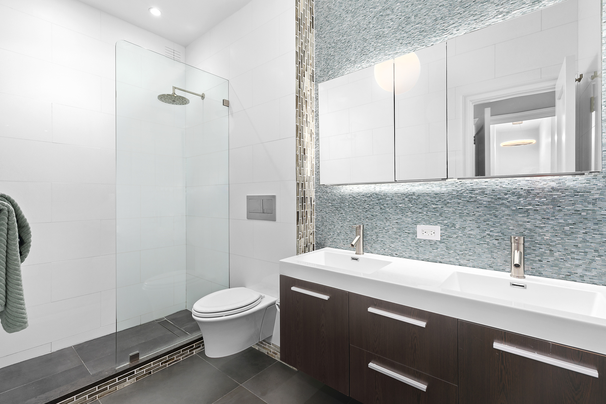 450 West 23rd Street, Unit E Manhattan, NY 10011 - Photo 6 of 12 a bathroom with a sink a toilet and shower