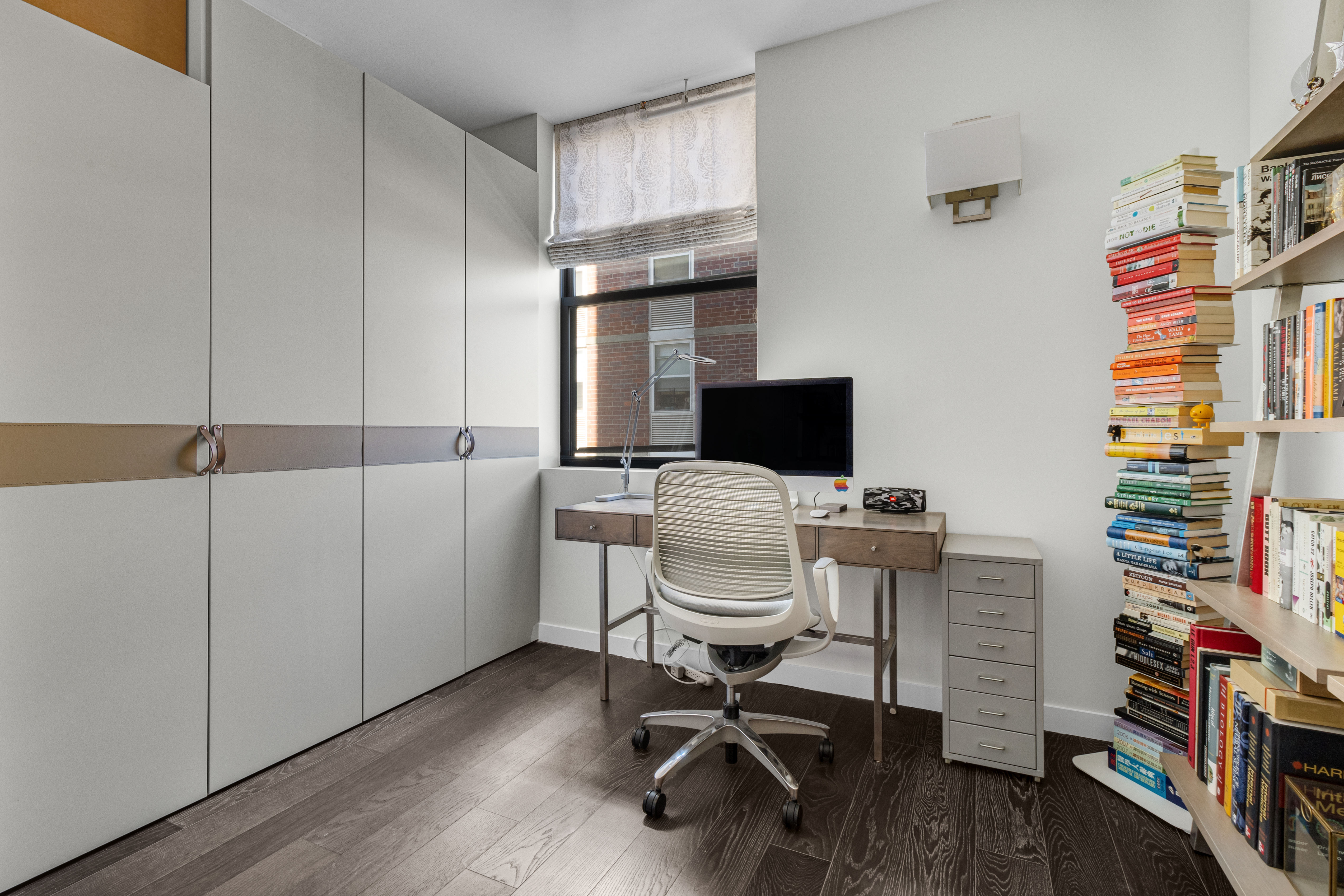 302 East 96th Street, Unit 1103 Manhattan, NY 10128 - Photo 11 of 22 a view of a workspace with furniture