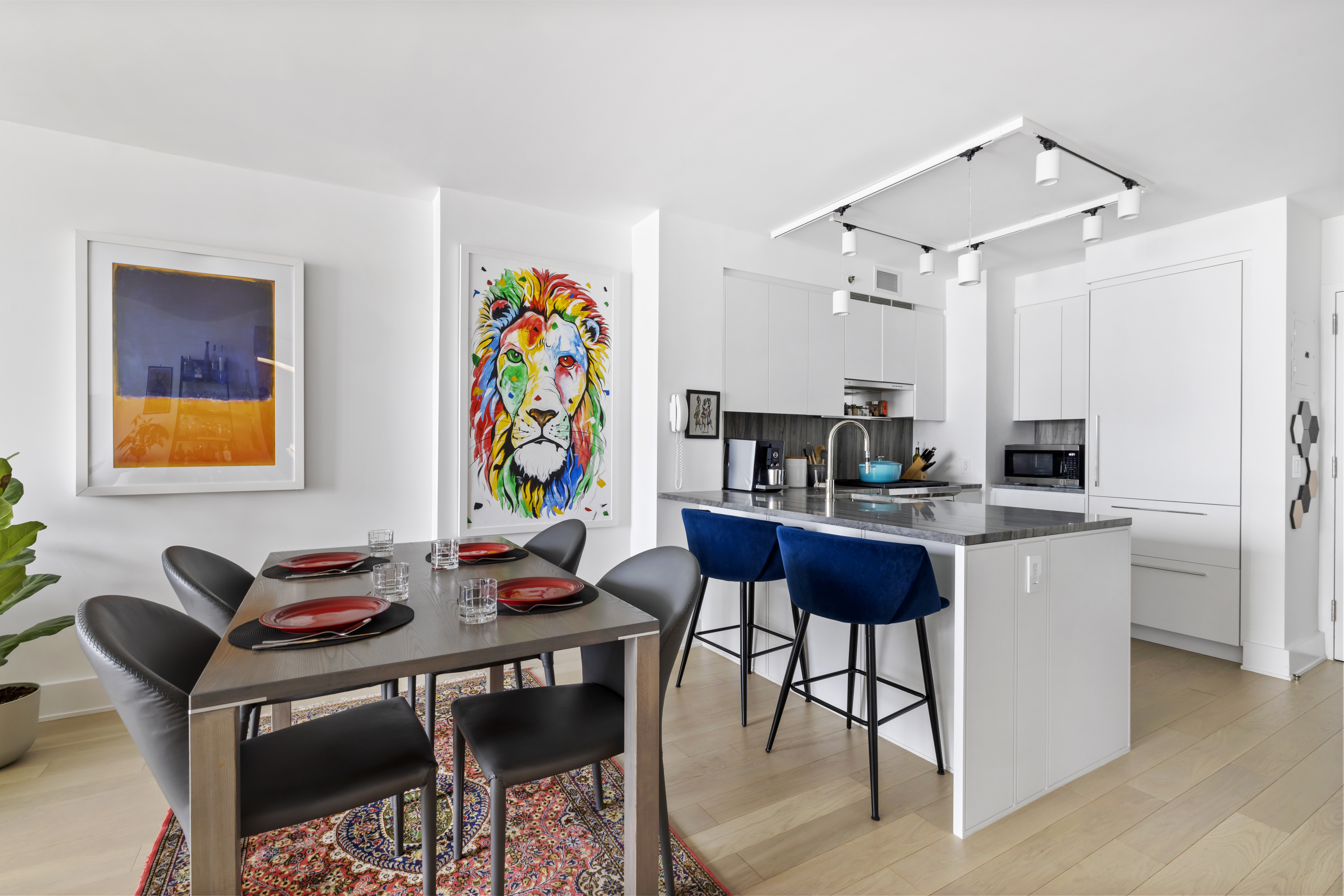 20 River Terrace, Unit 7K Manhattan, NY 10282 - Photo 4 of 9 a view of a dining room with furniture and wooden floor