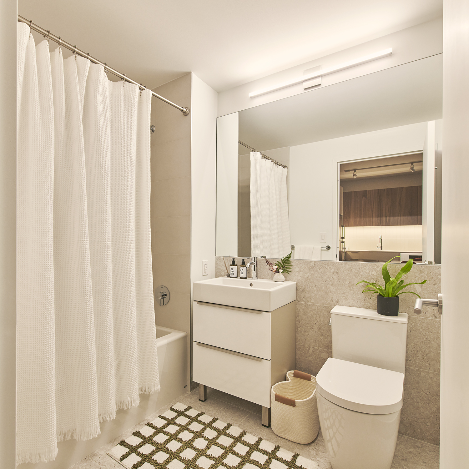 30-77 Vernon Boulevard, Unit 514W Queens, NY 11102 - Photo 4 of 21 a bathroom with a toilet sink and mirror