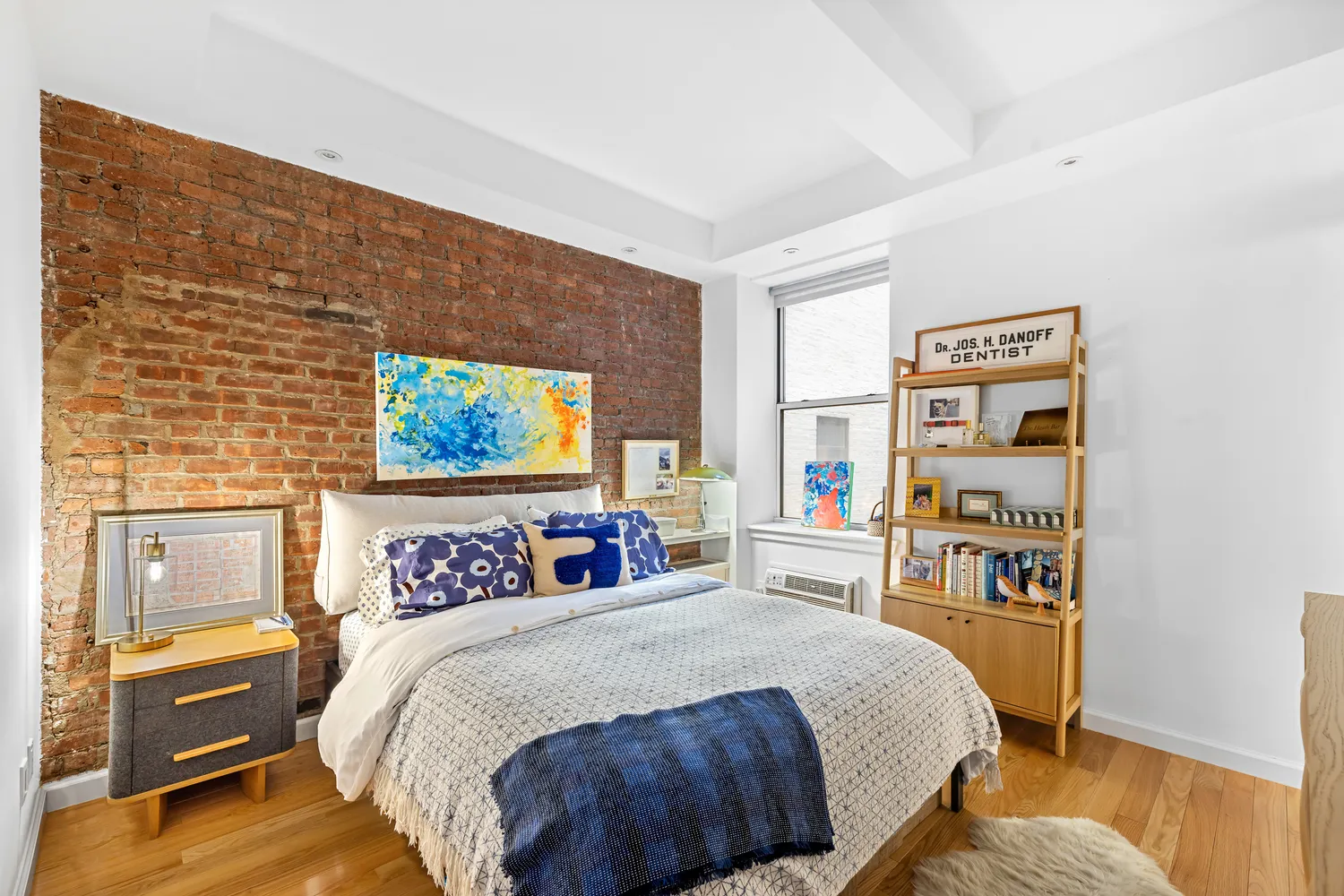 a bedroom with a bed and a desk