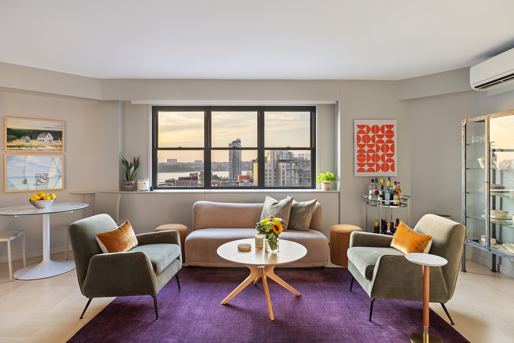 31 Jane Street, Unit 16A Manhattan, NY 10014 - Photo 1 of 17 a living room with furniture and a large window