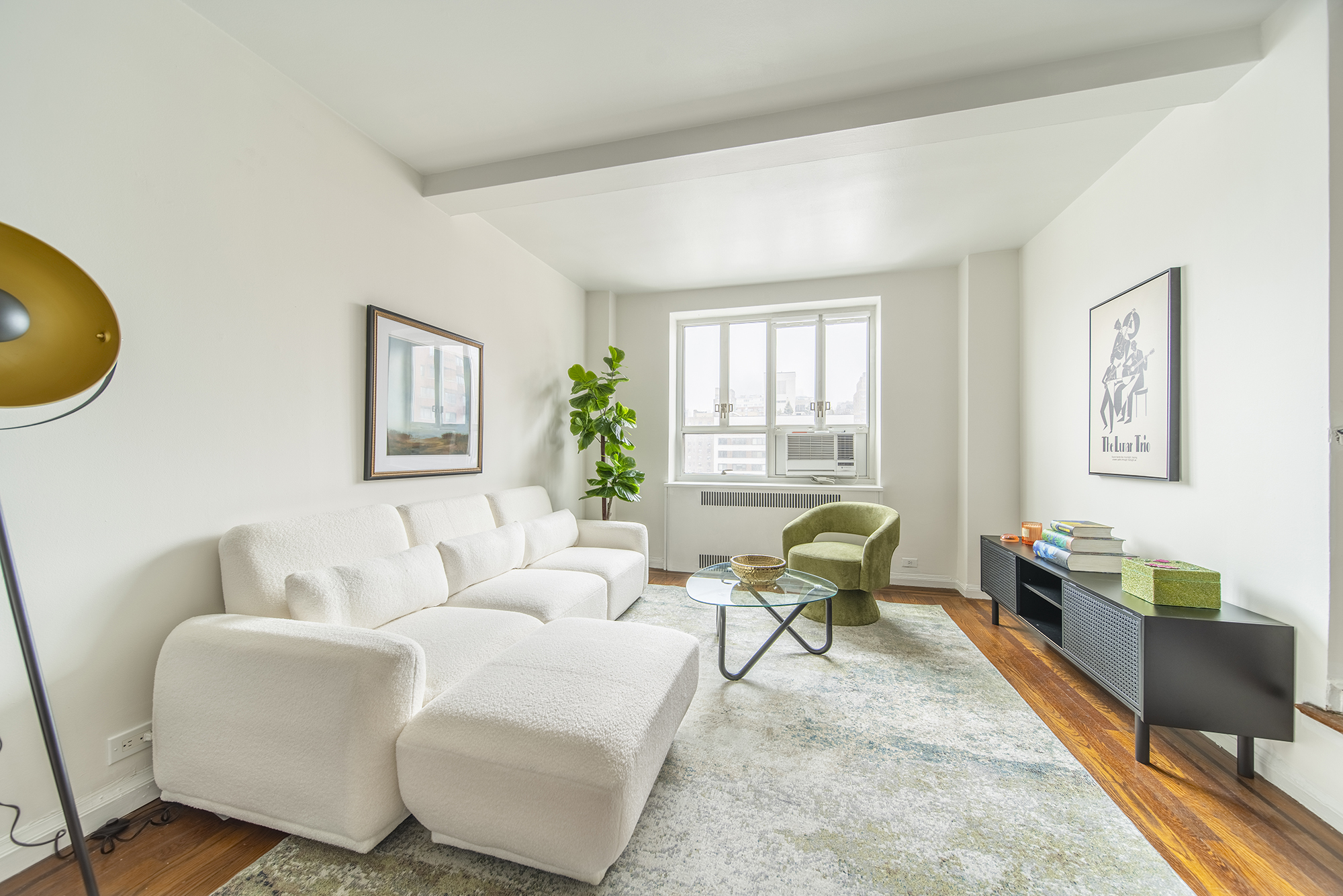 200 West 20th Street, Unit 1208 Manhattan, NY 10011 - Photo 2 of 14 a living room with furniture and a window