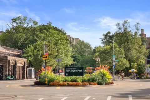 a view of a street with a building in the background