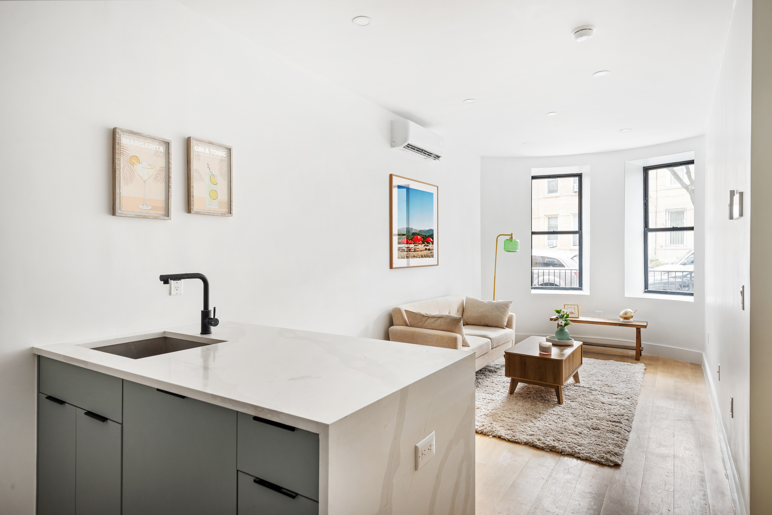 140 Moffat Street, Unit 1 Brooklyn, NY 11207 - Photo 2 of 9 a living room with furniture and window